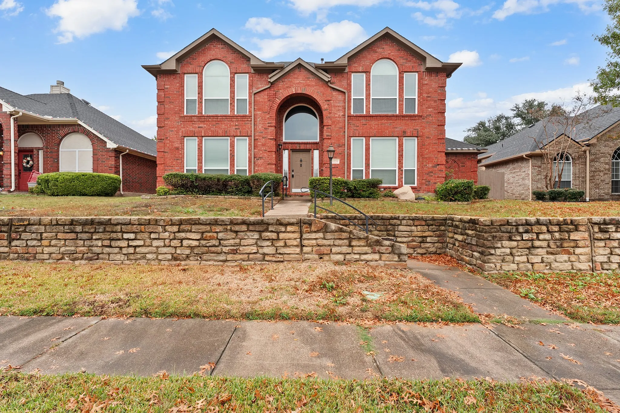 Traditional home with brick siding