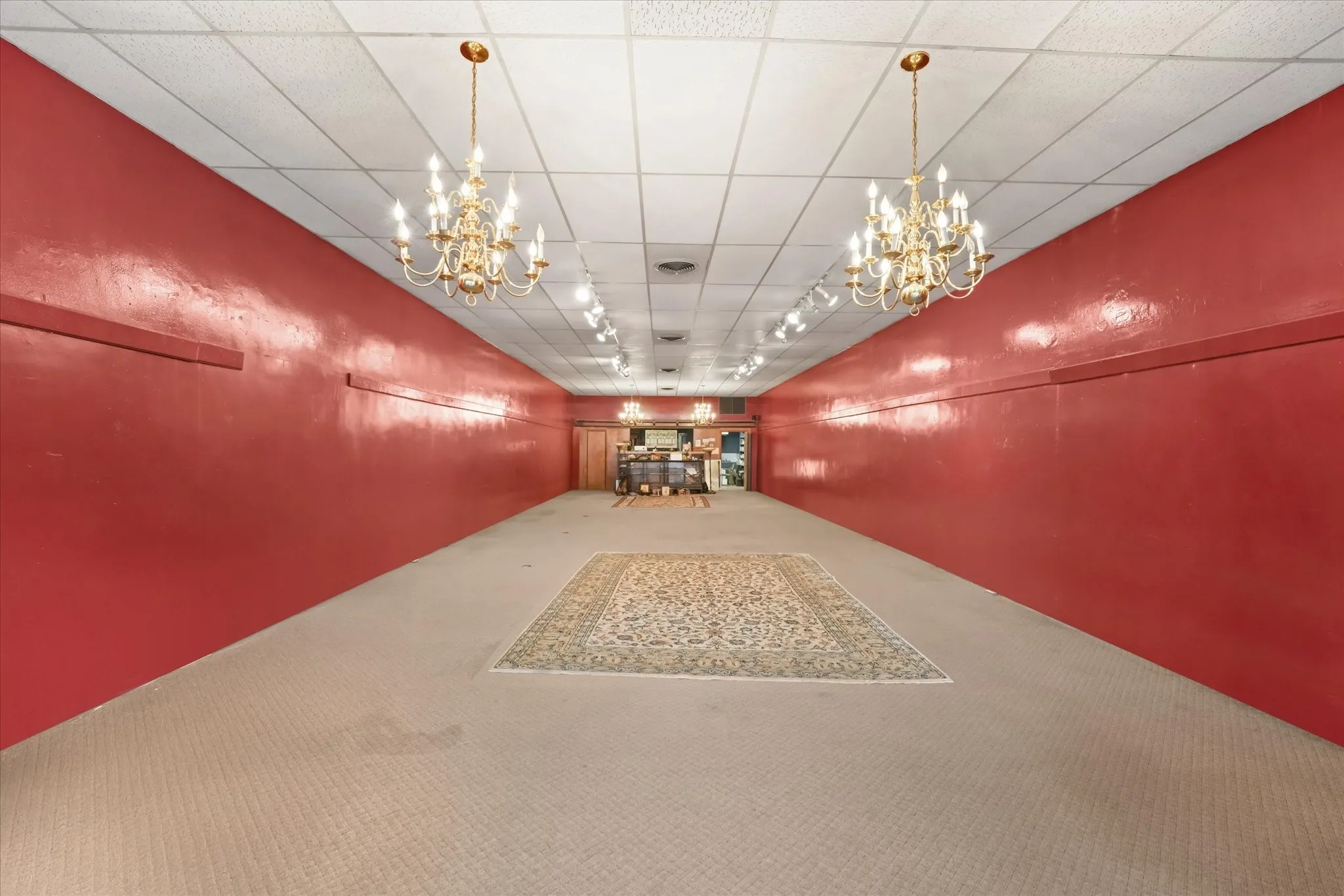 Above this drop ceiling are the original metal tiles