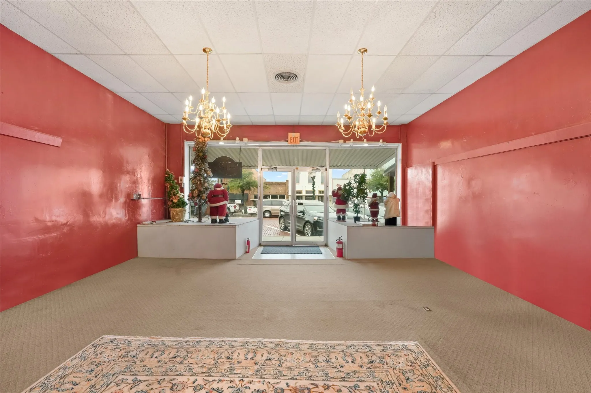 Reception featuring a chandelier and a drop ceiling