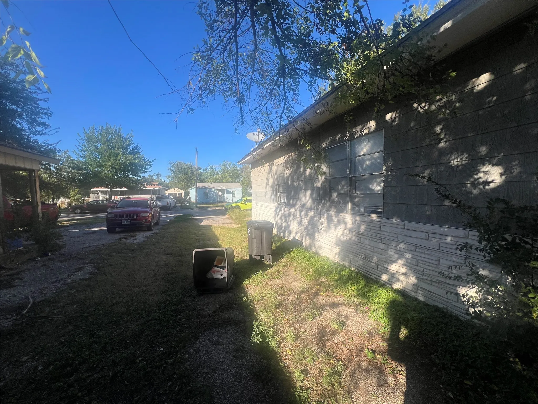 View of home's exterior with a yard