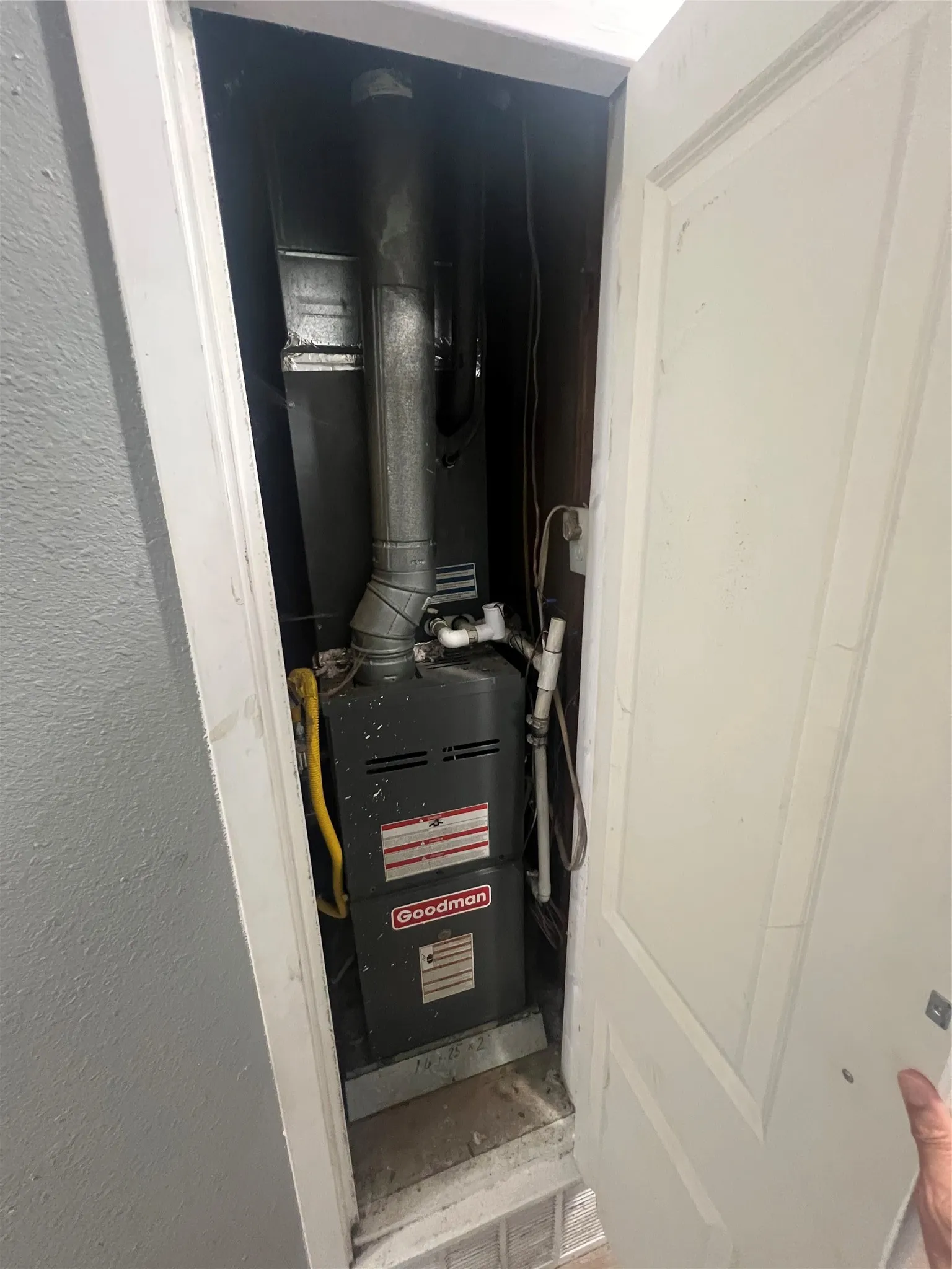 Utility room featuring heating unit