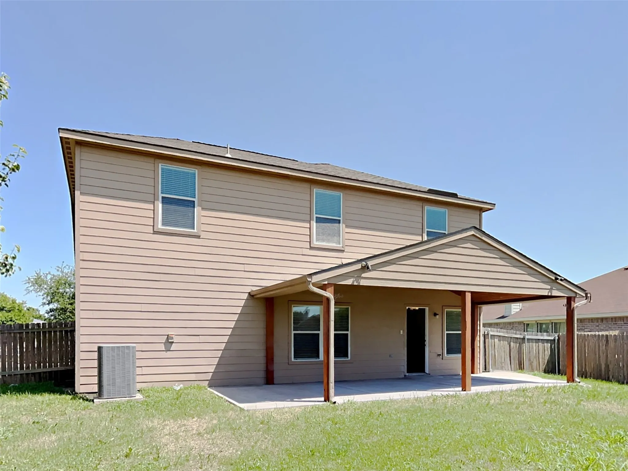 Back of house featuring a patio and a fenced backyard