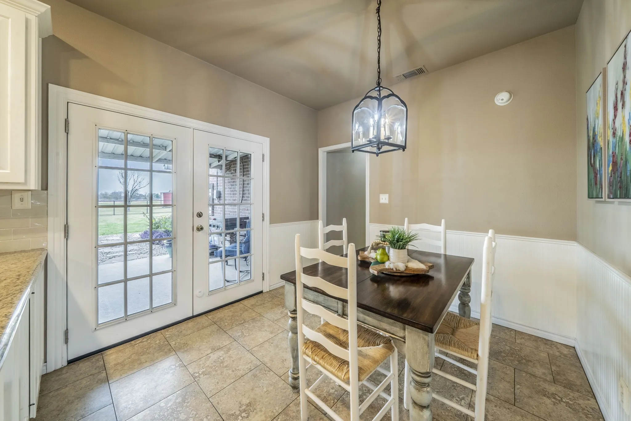Eat in kitchen with double doors to back covered patio