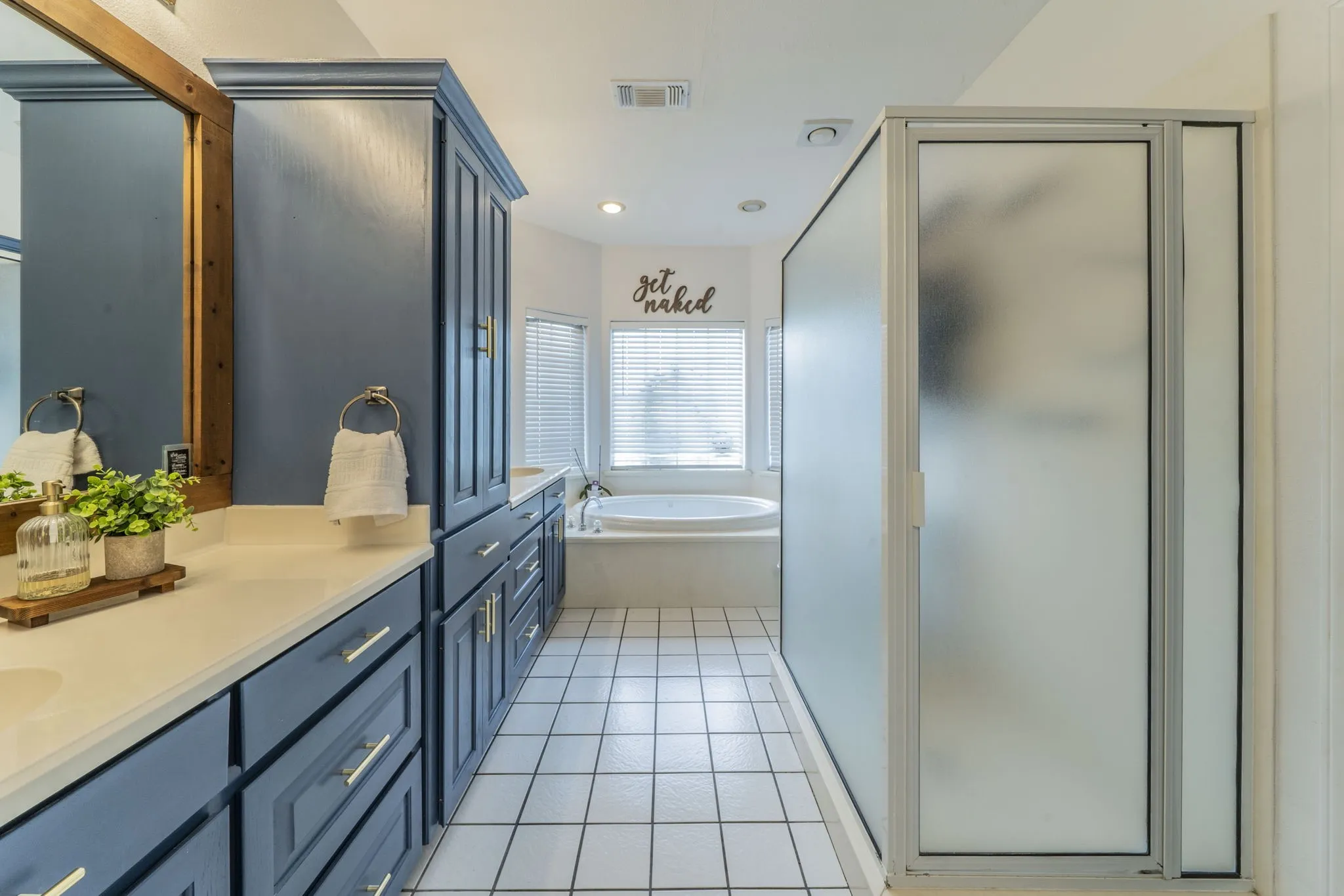 primary bath with separate soaking tub and shower