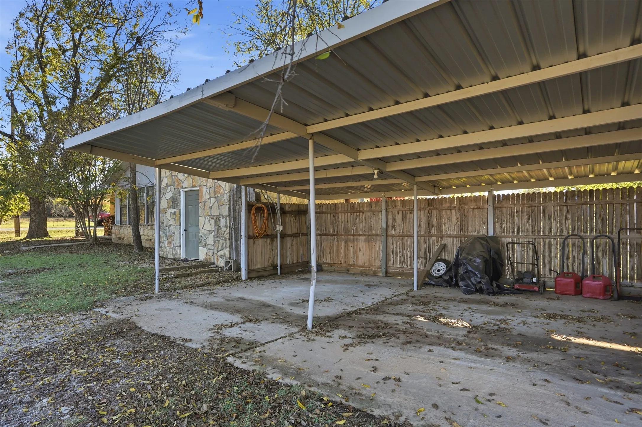 View of patio / terrace featuring a carport