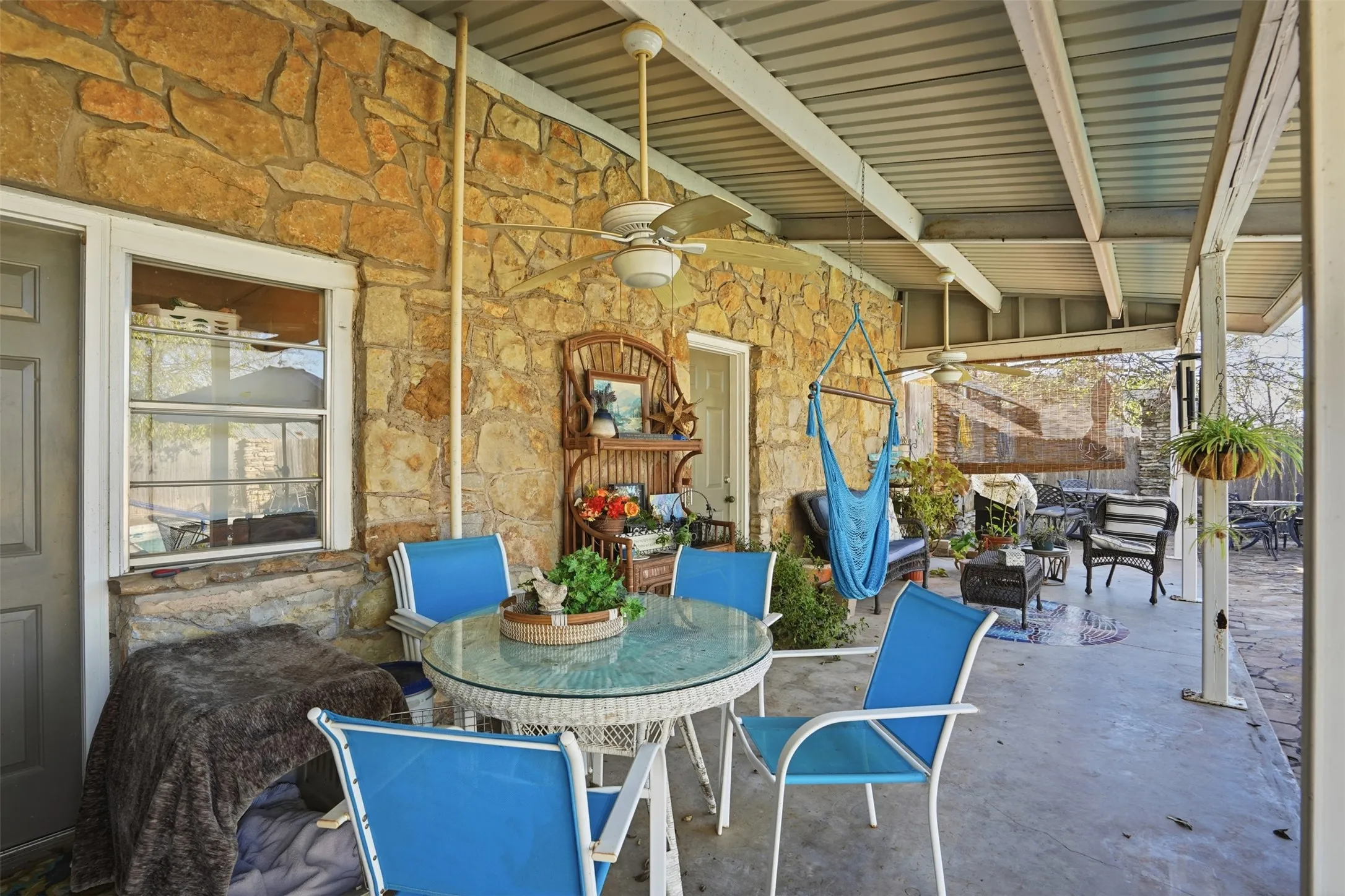 View of patio featuring outdoor dining space and a ceiling fan