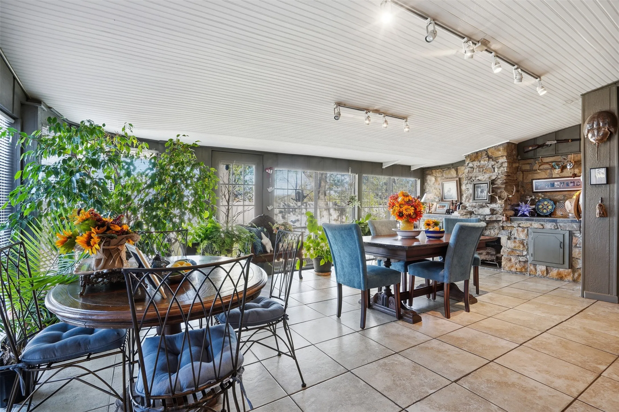 Tiled dining area with track lighting
