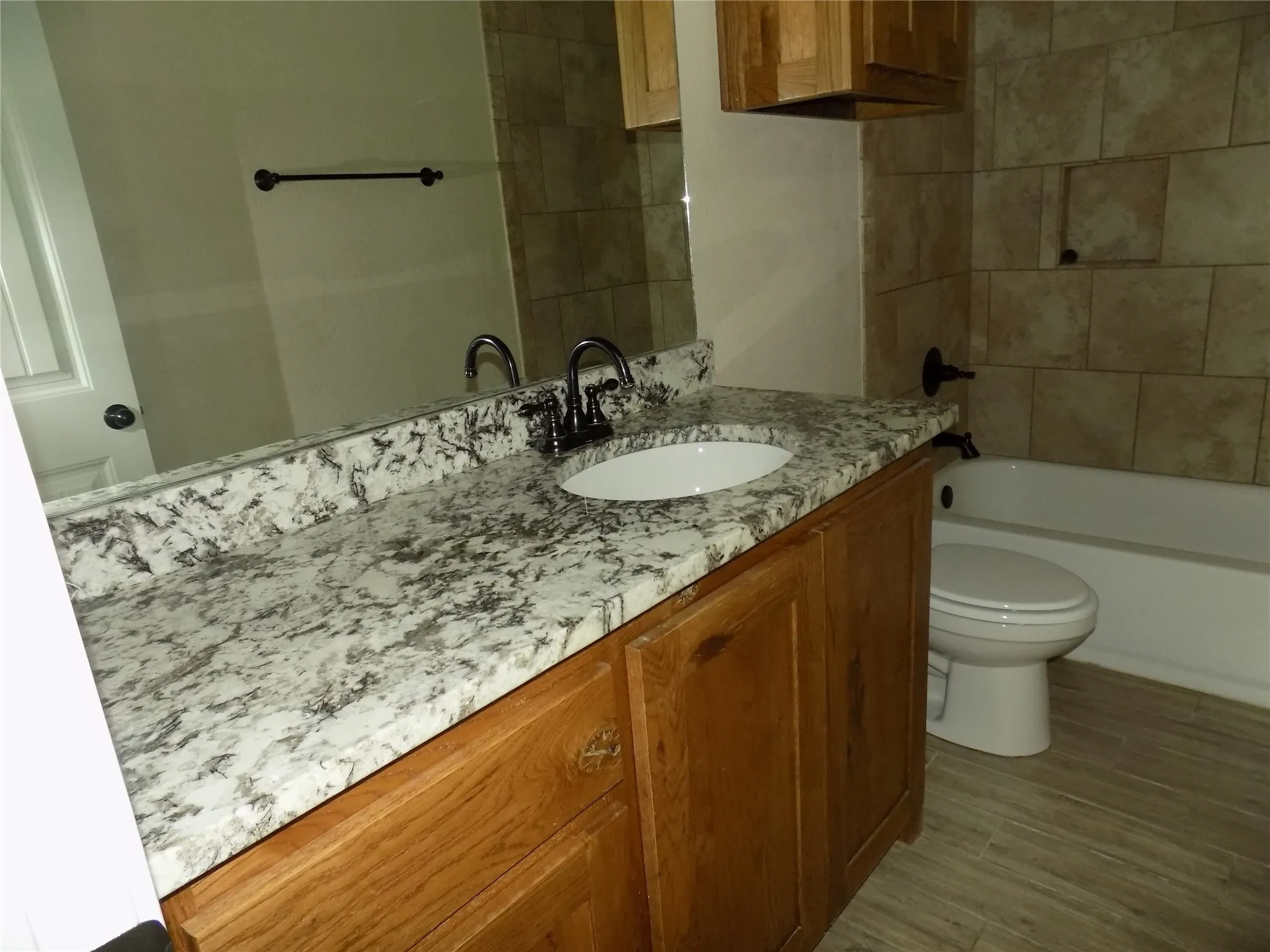 Guest bathroom with granite countertop.