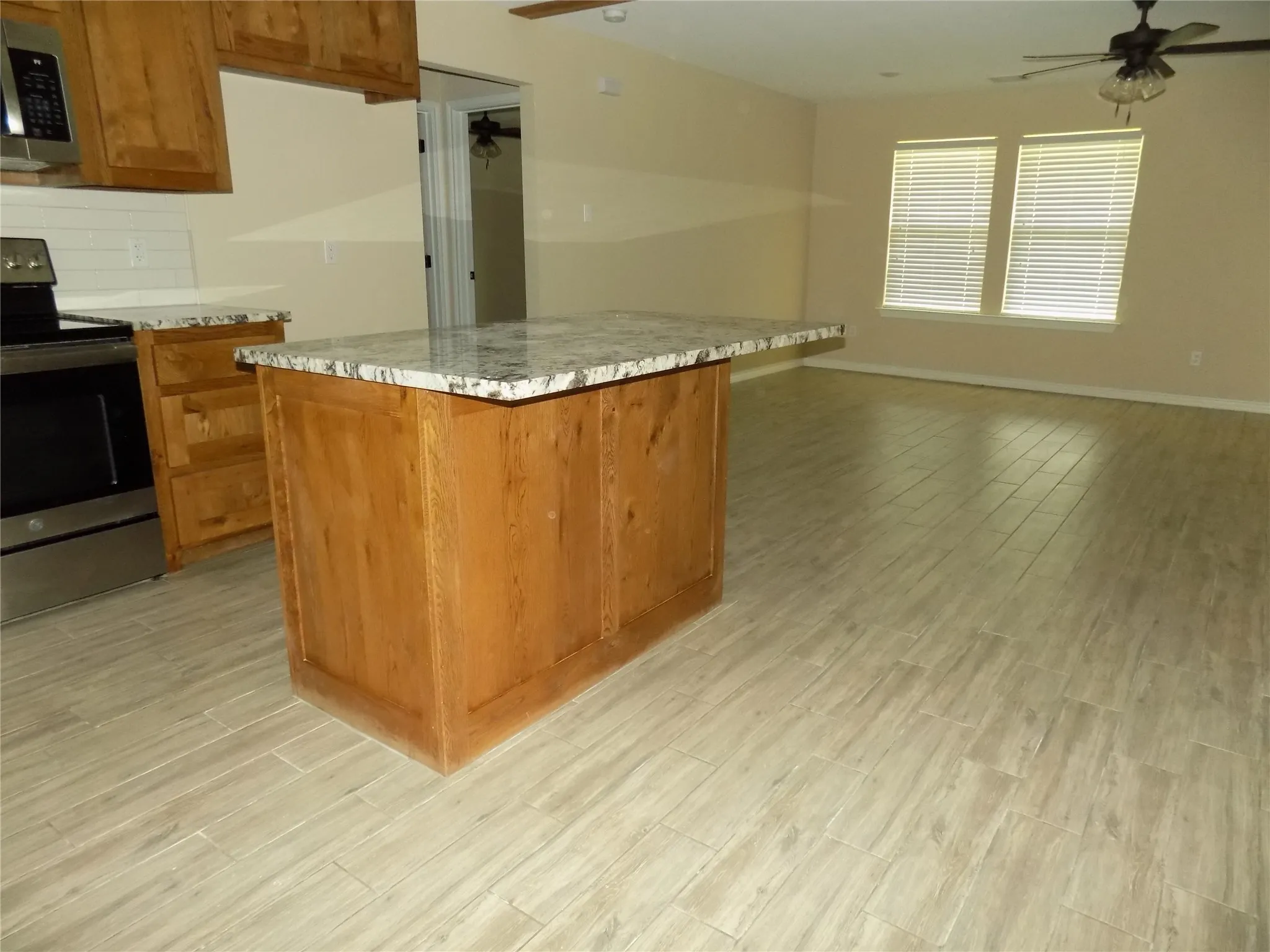 Flipped side of the kitchen island that can accommodate stools for eating or visiting.