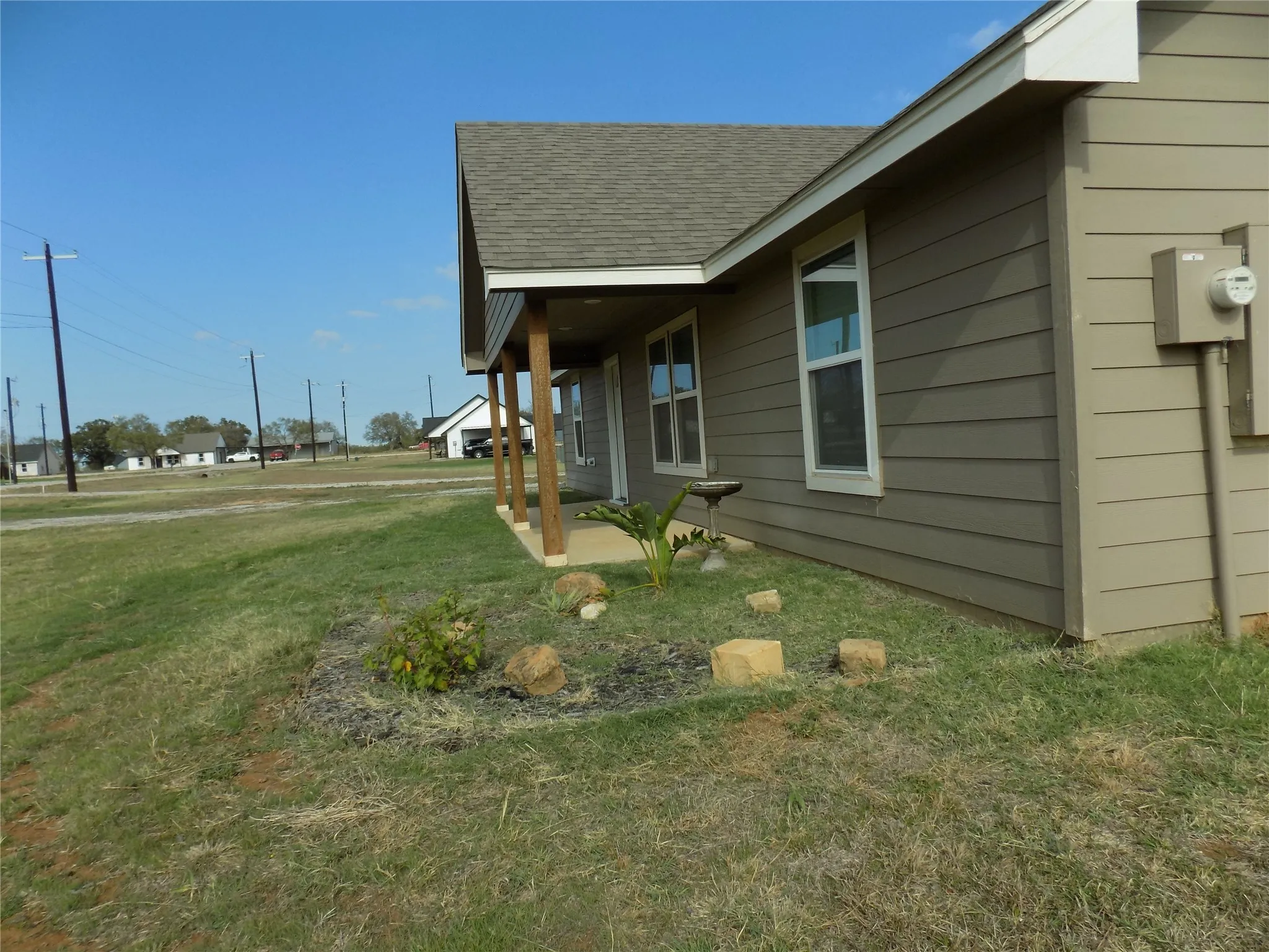 Side picture of front porch, giving a better up close look.  Wonderful front yard area.