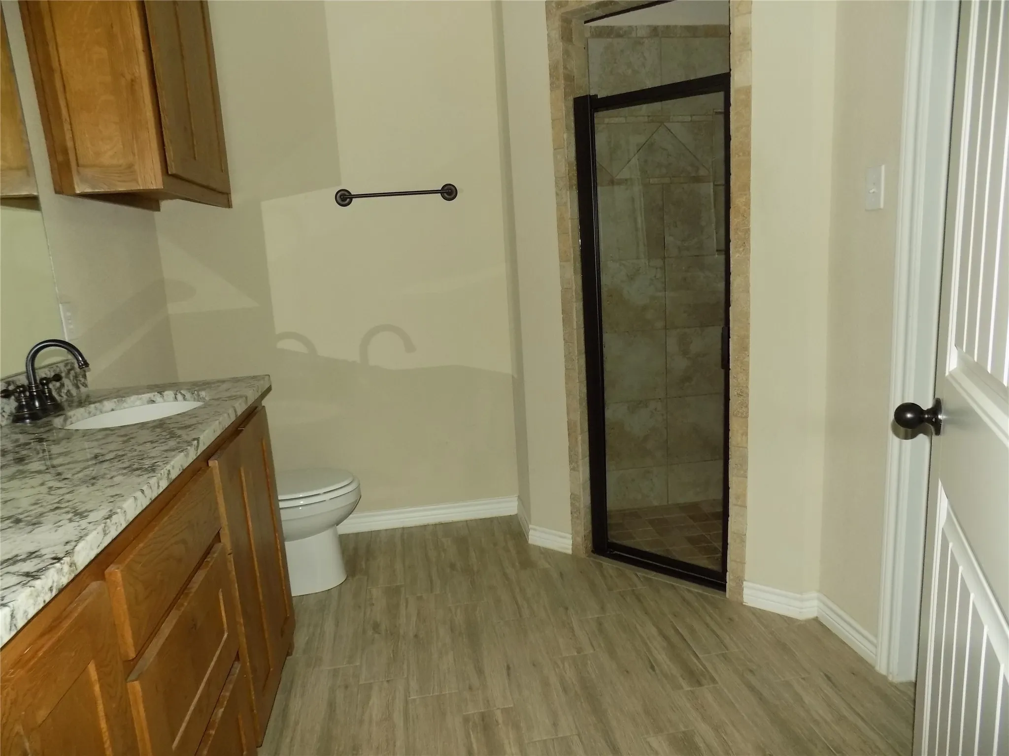 Bathroom features large, separate shower and walk-in closet.