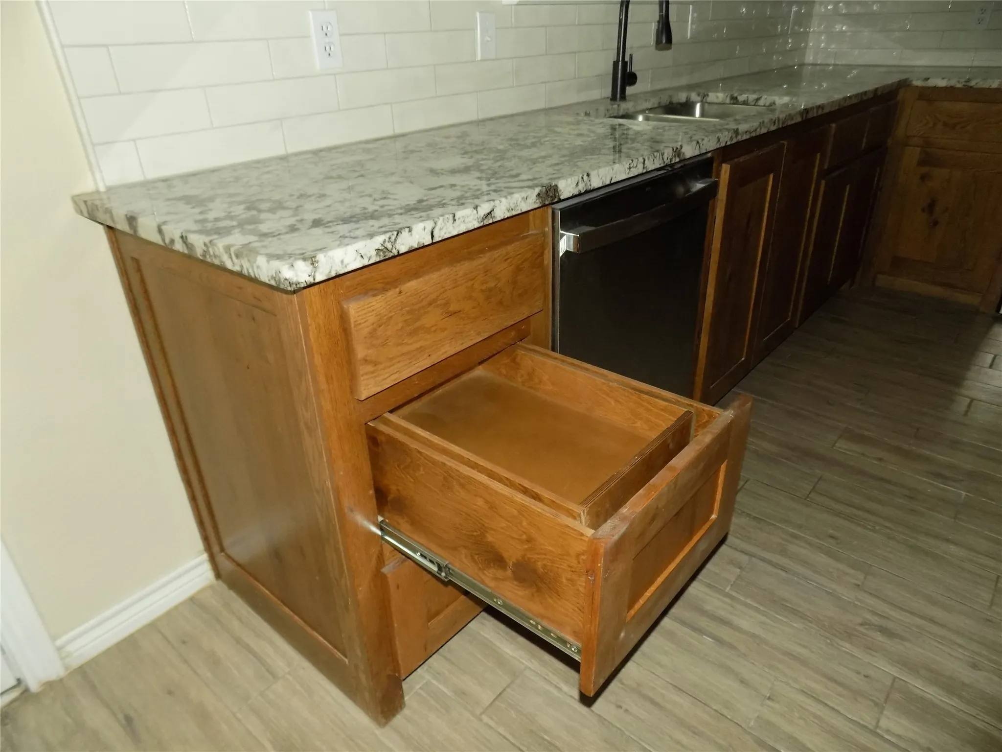Kitchen featuring special appointments, like drawer addition.
