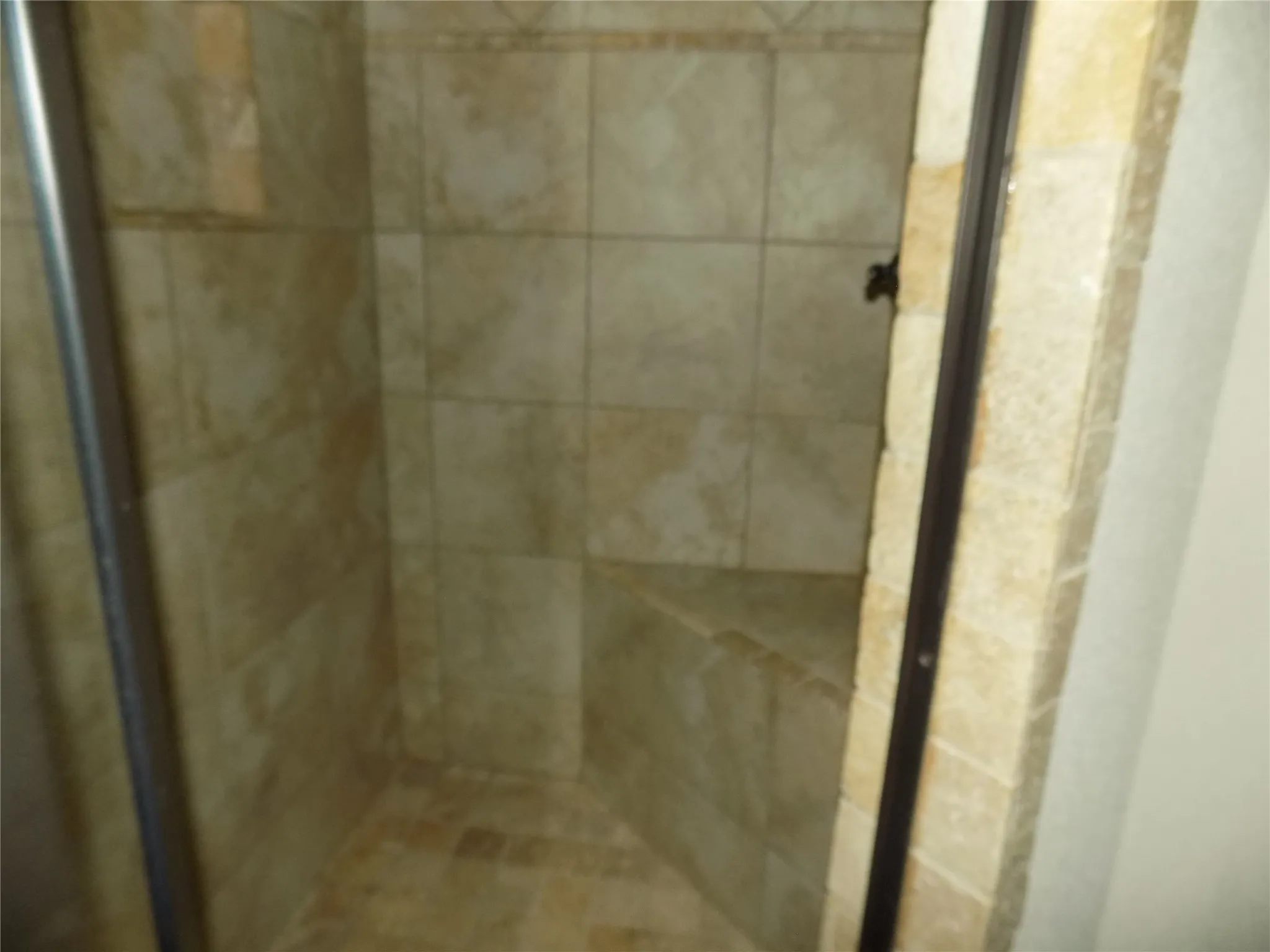 Beautiful shower with convenient shower seat.