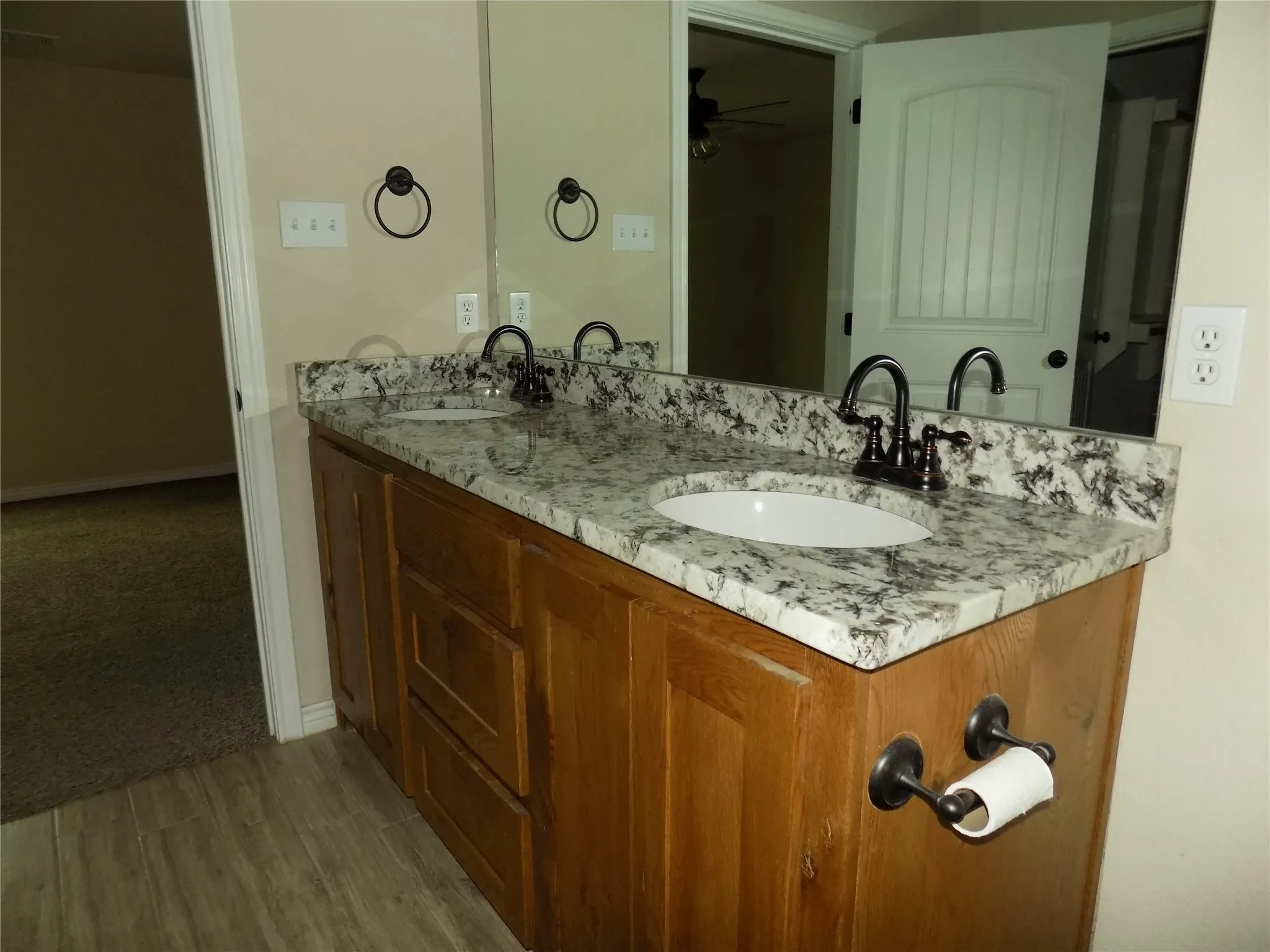 Primary bath is beautiful with double sinks and granite counter tops over spacious cabinets.