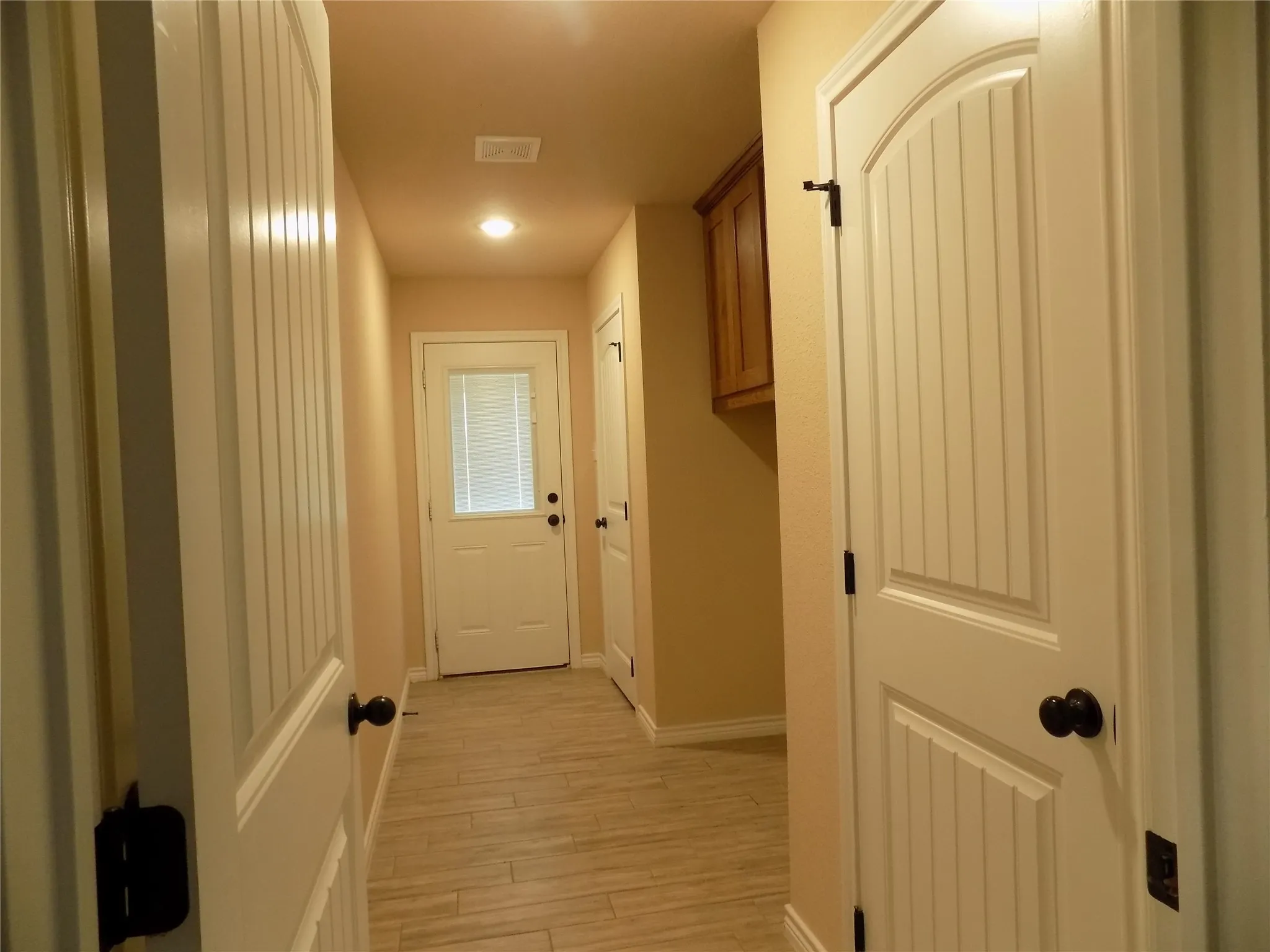 So much more than a laundry room.  Coat closet next to entry door, and pantry toward the back of the laundry room.  Very roomy and a quick delivery process for grocery delivery to the kitchen.