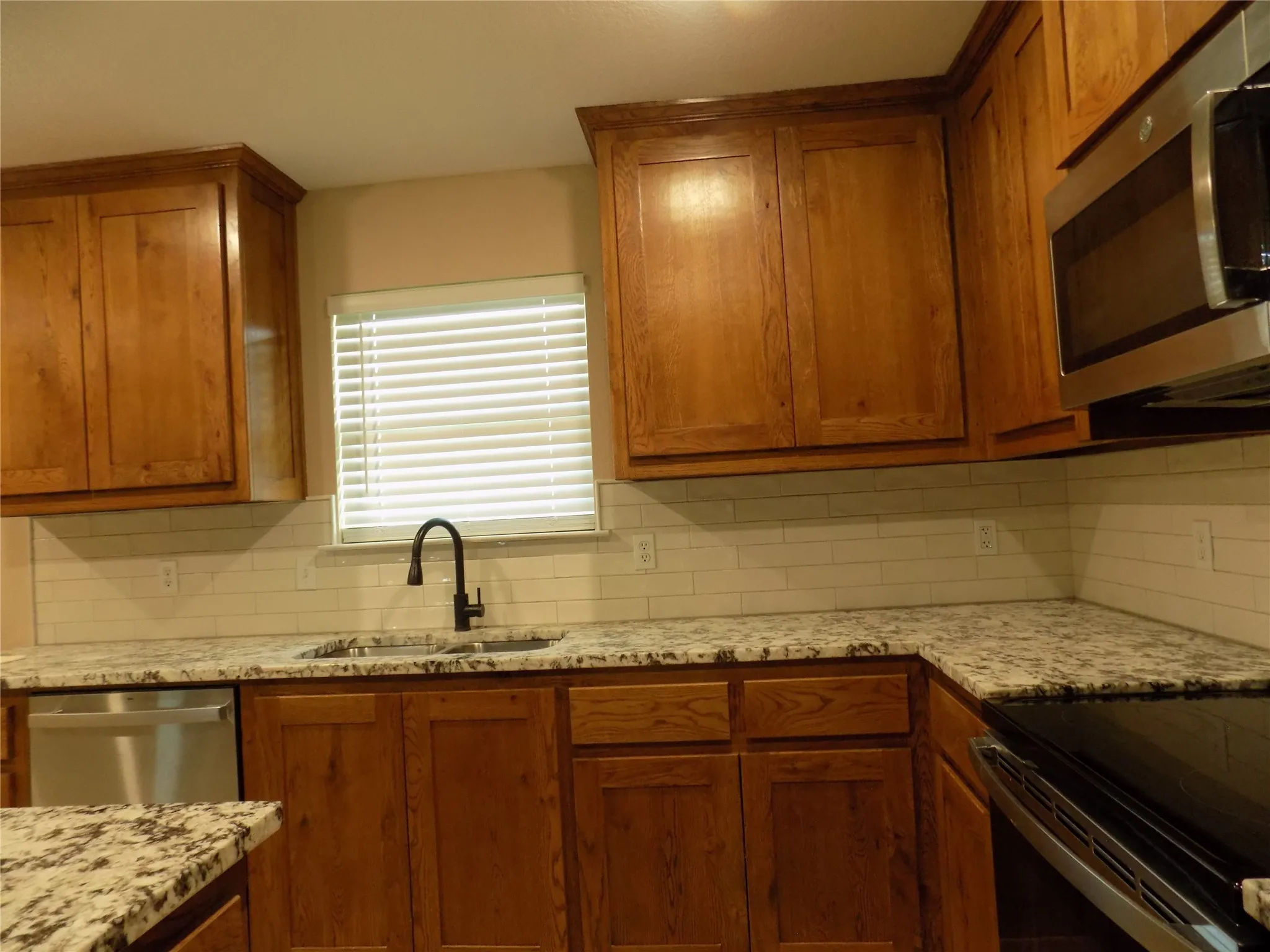 Kitchen features window over sink; great view.
