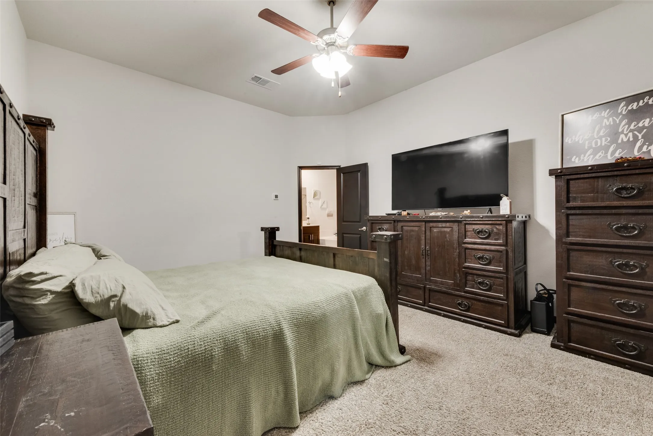 Bedroom featuring carpet floors and ceiling fan