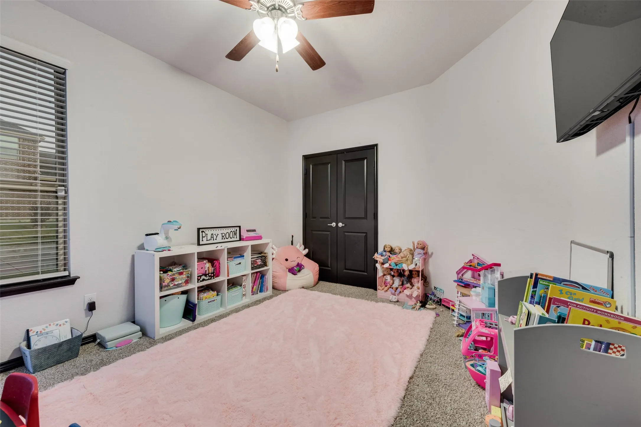 Game room featuring carpet and a ceiling fan