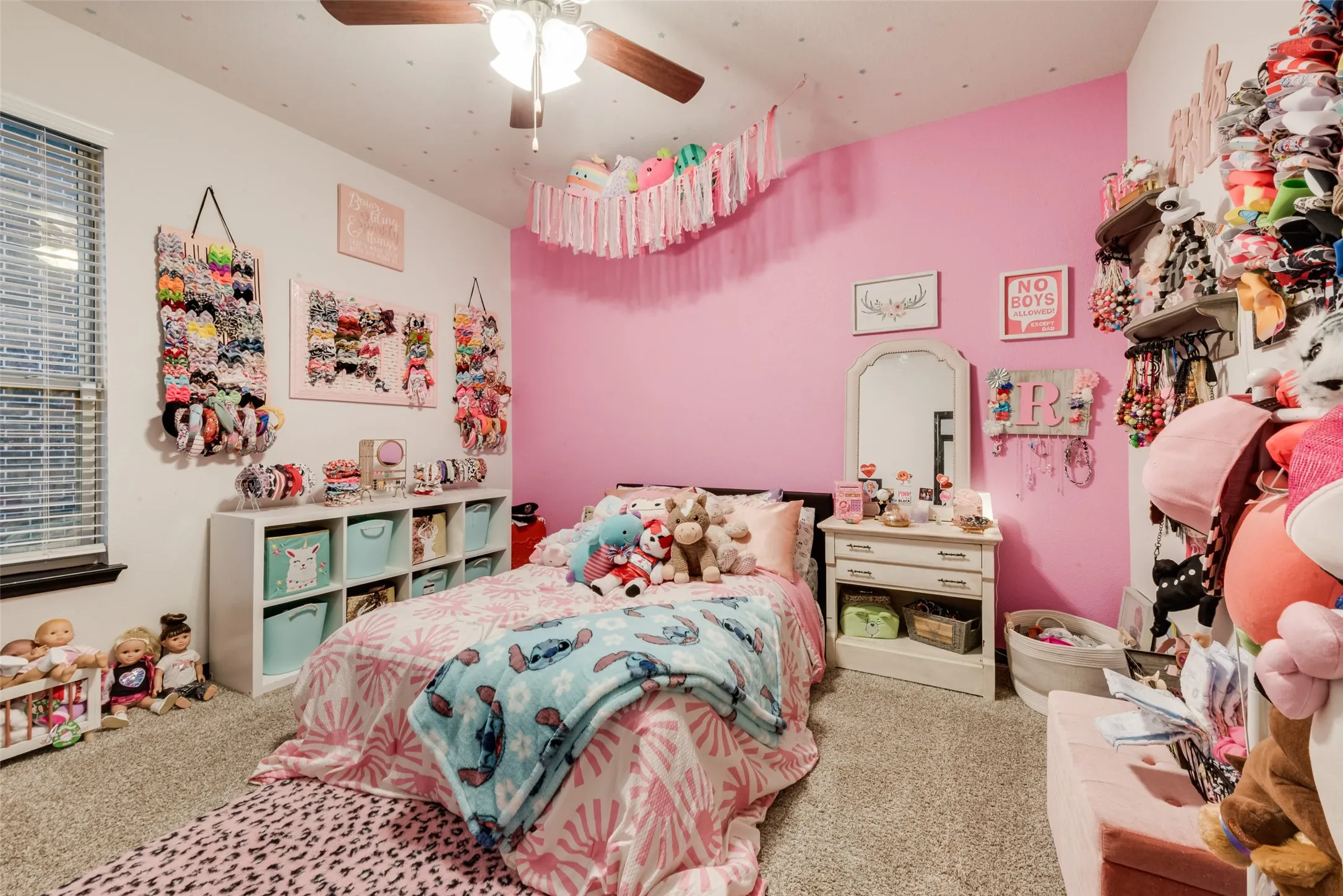 Bedroom with carpet floors and a ceiling fan