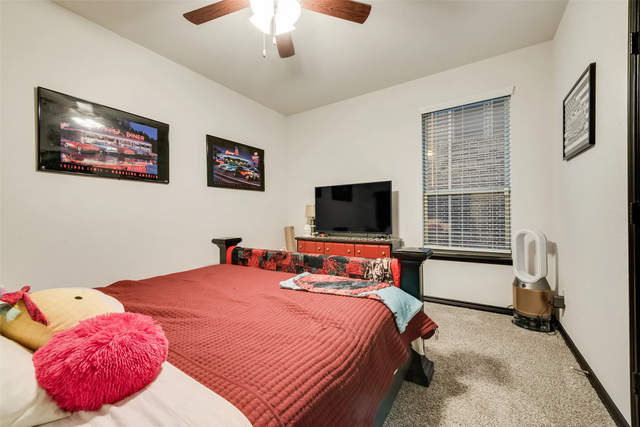 Bedroom featuring carpet floors and ceiling fan