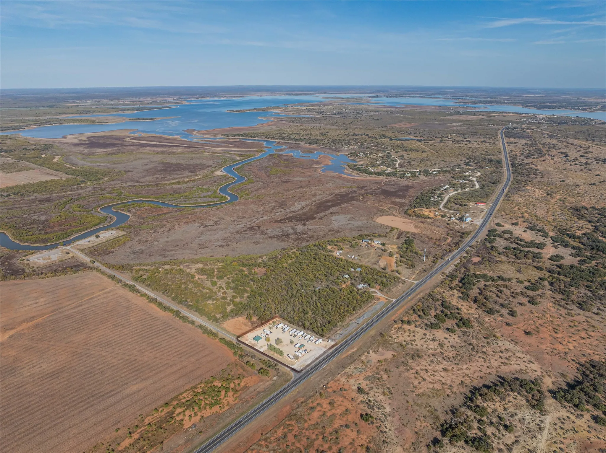 Aerial overview of property's location featuring a nearby body of water and rural landscape