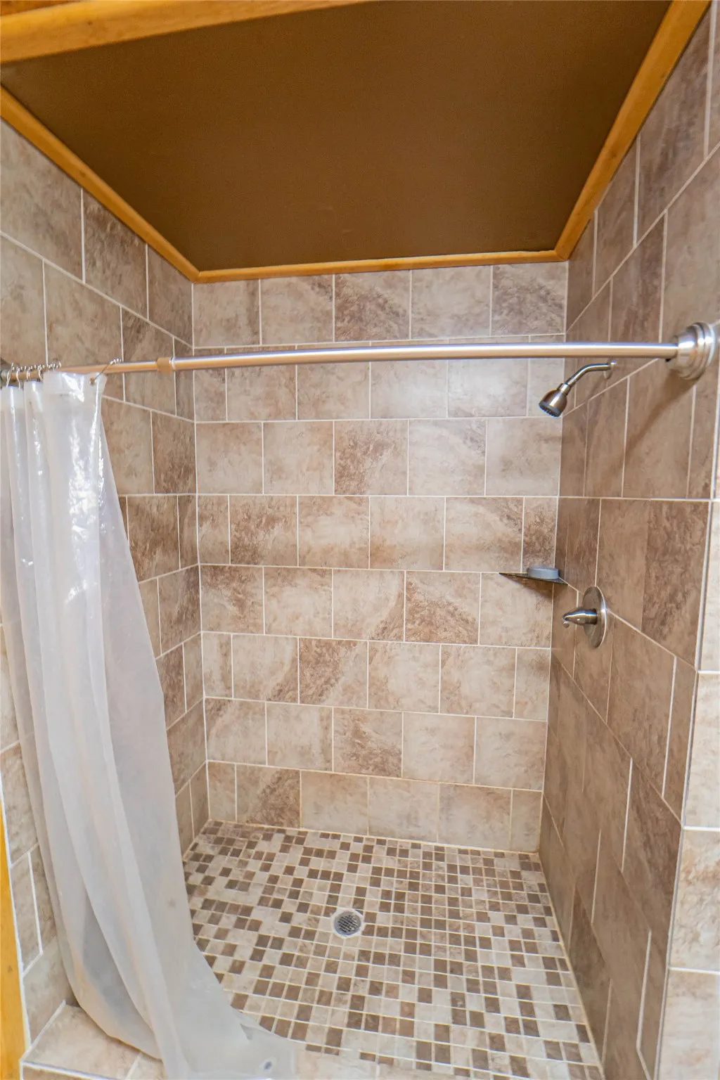 Full bath featuring a shower stall