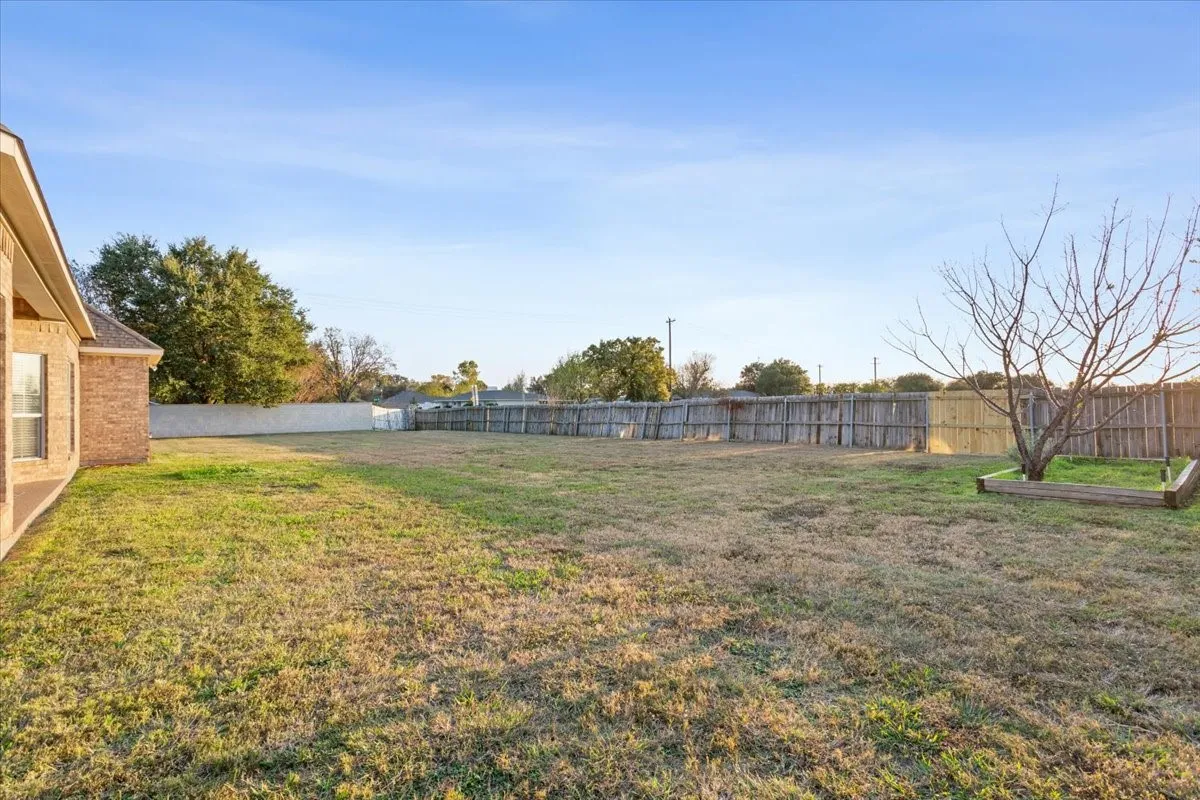 View of fenced backyard