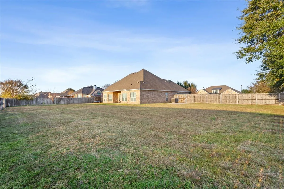 View of fenced backyard