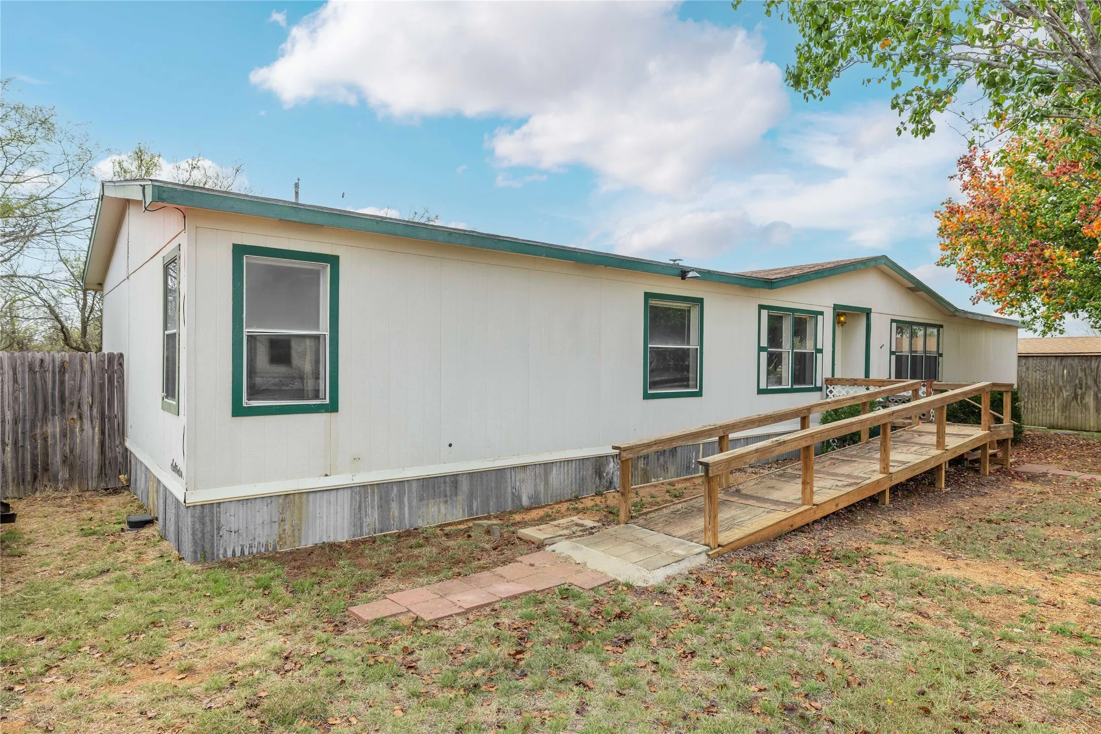 Rear view of house featuring a deck