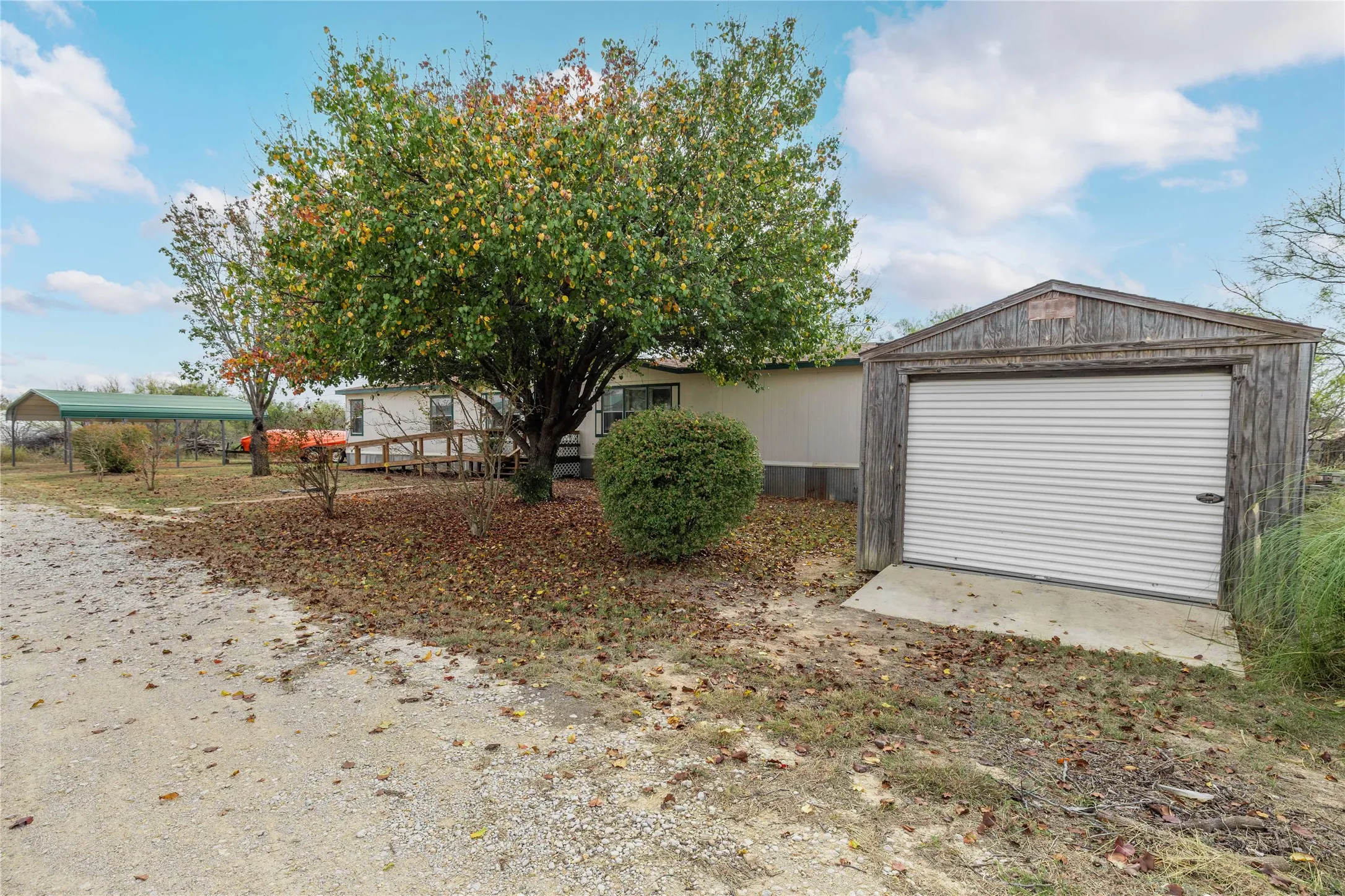 View of front of property featuring an outbuilding