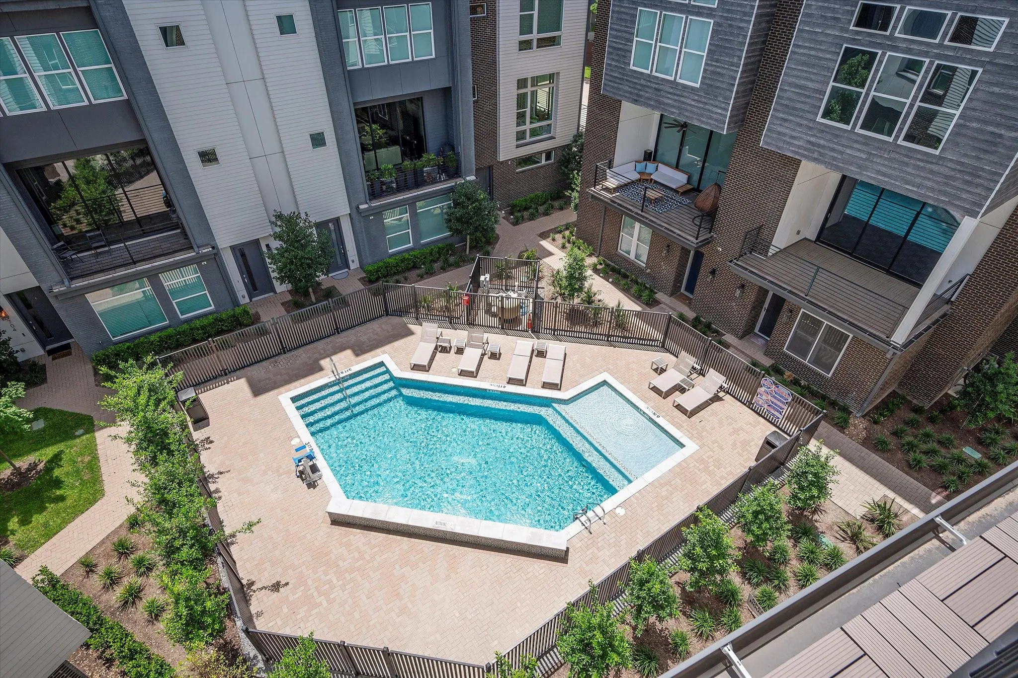 Community pool with a patio