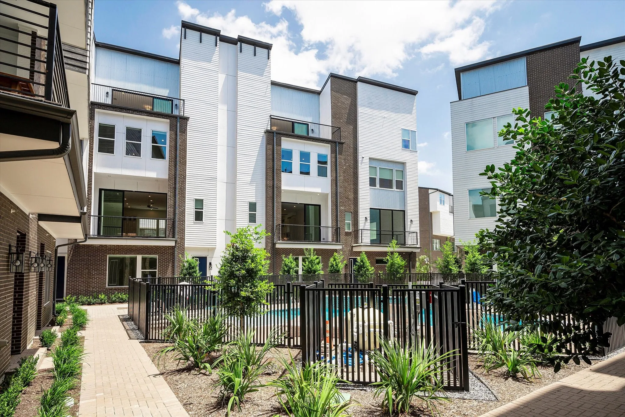 View of property featuring a community pool