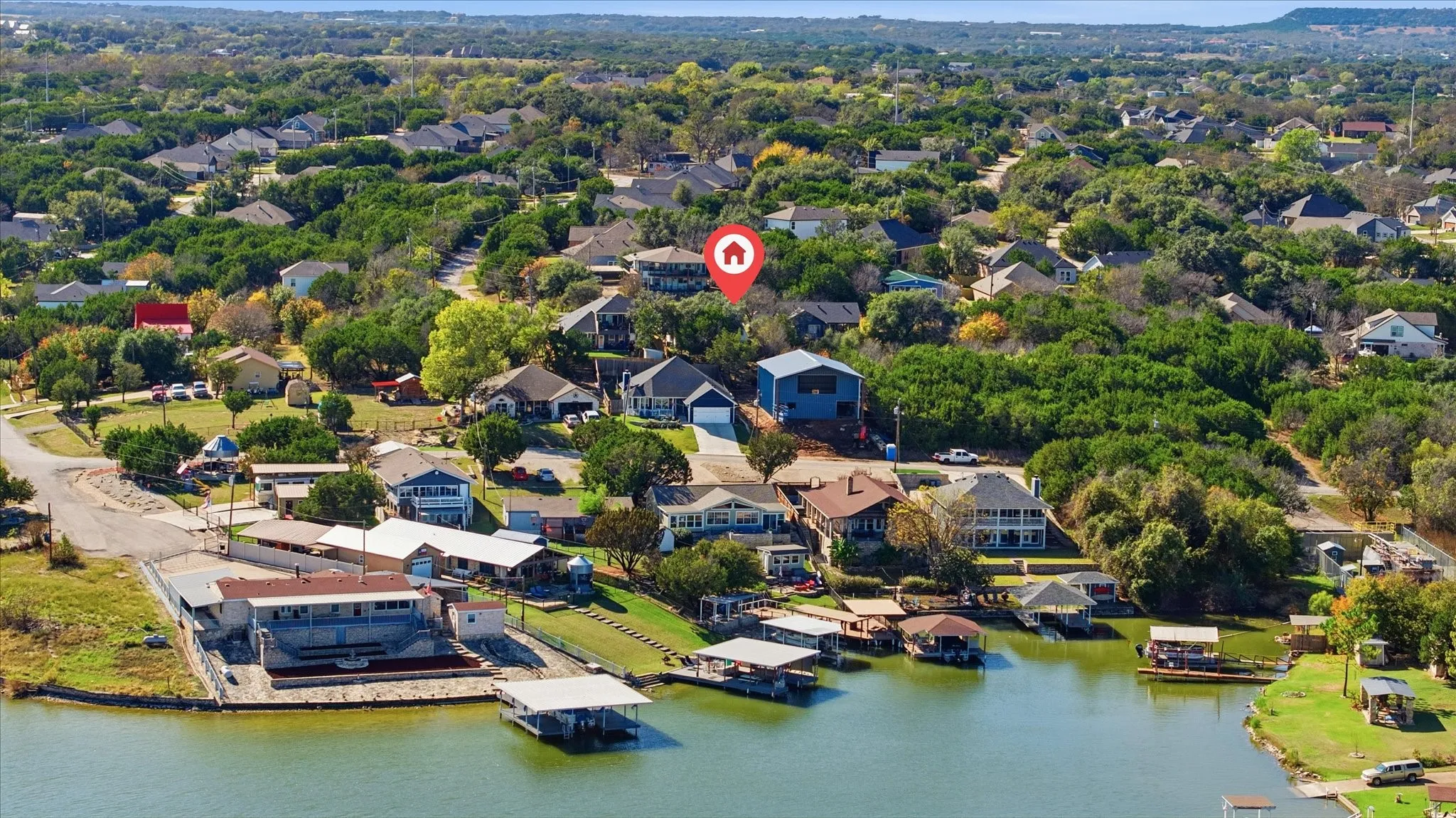 Aerial perspective of suburban area with a large body of water