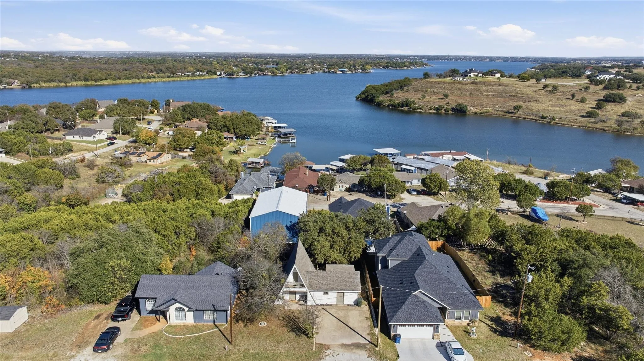 View of property location featuring nearby suburban area and a nearby body of water