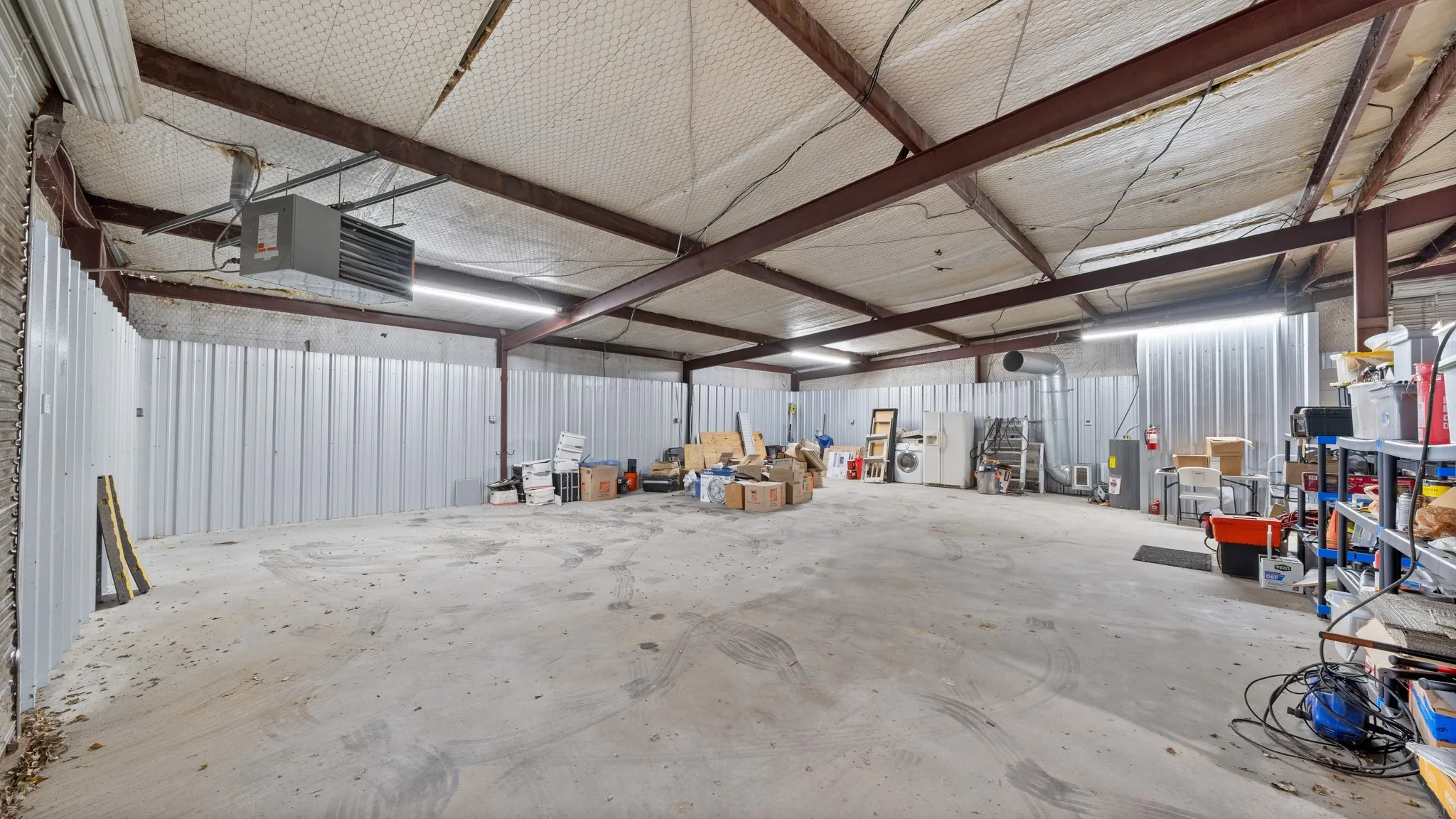 Garage with metal wall and a heating unit