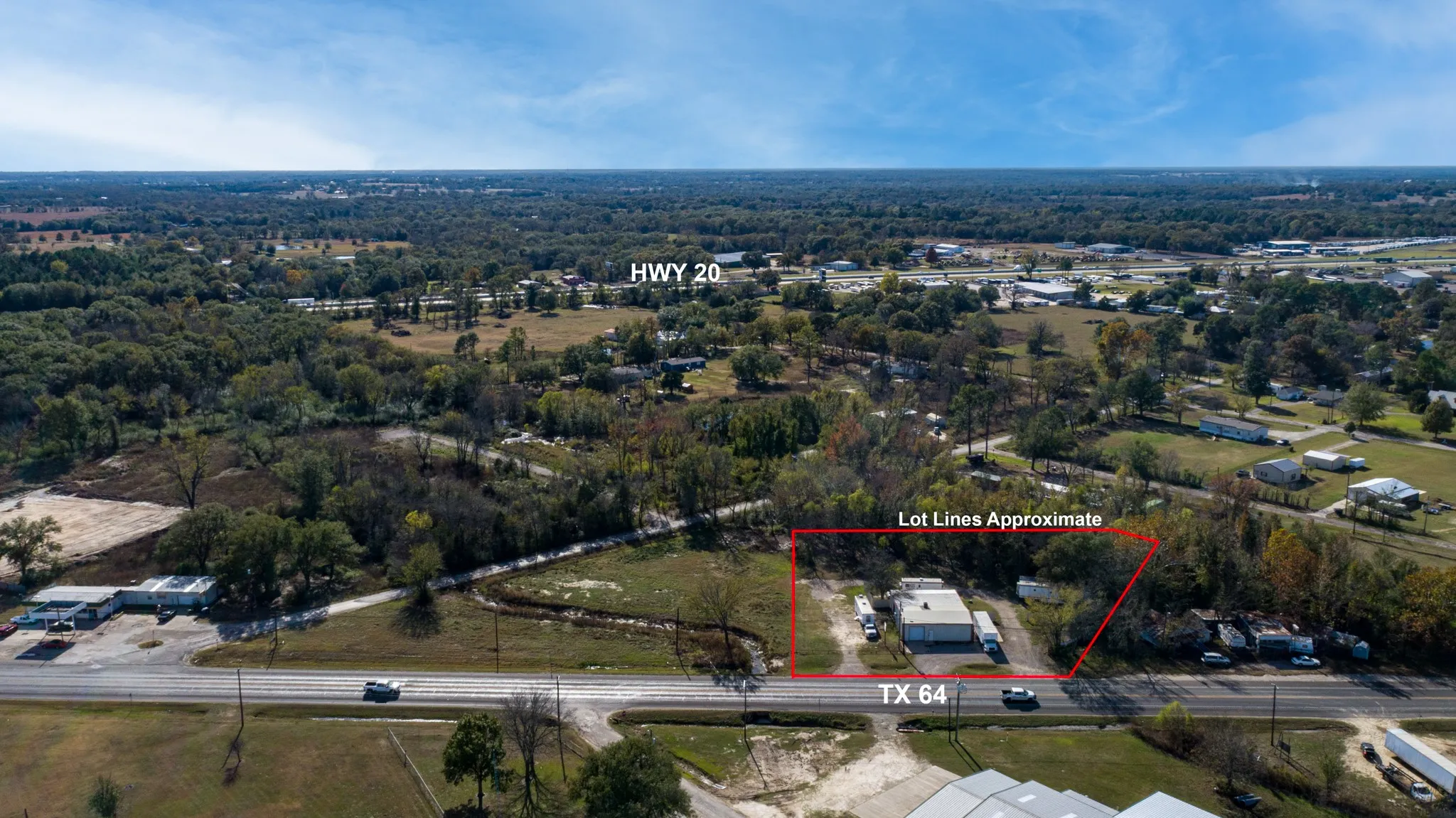 Aerial view of property and surrounding area featuring property boundaries highlighted