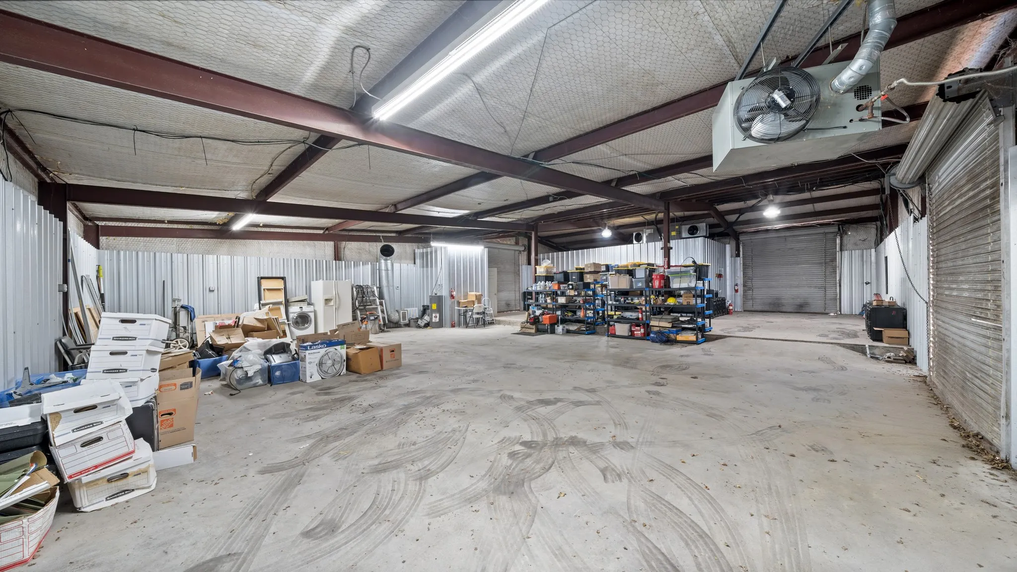 Garage with metal wall and a workshop area