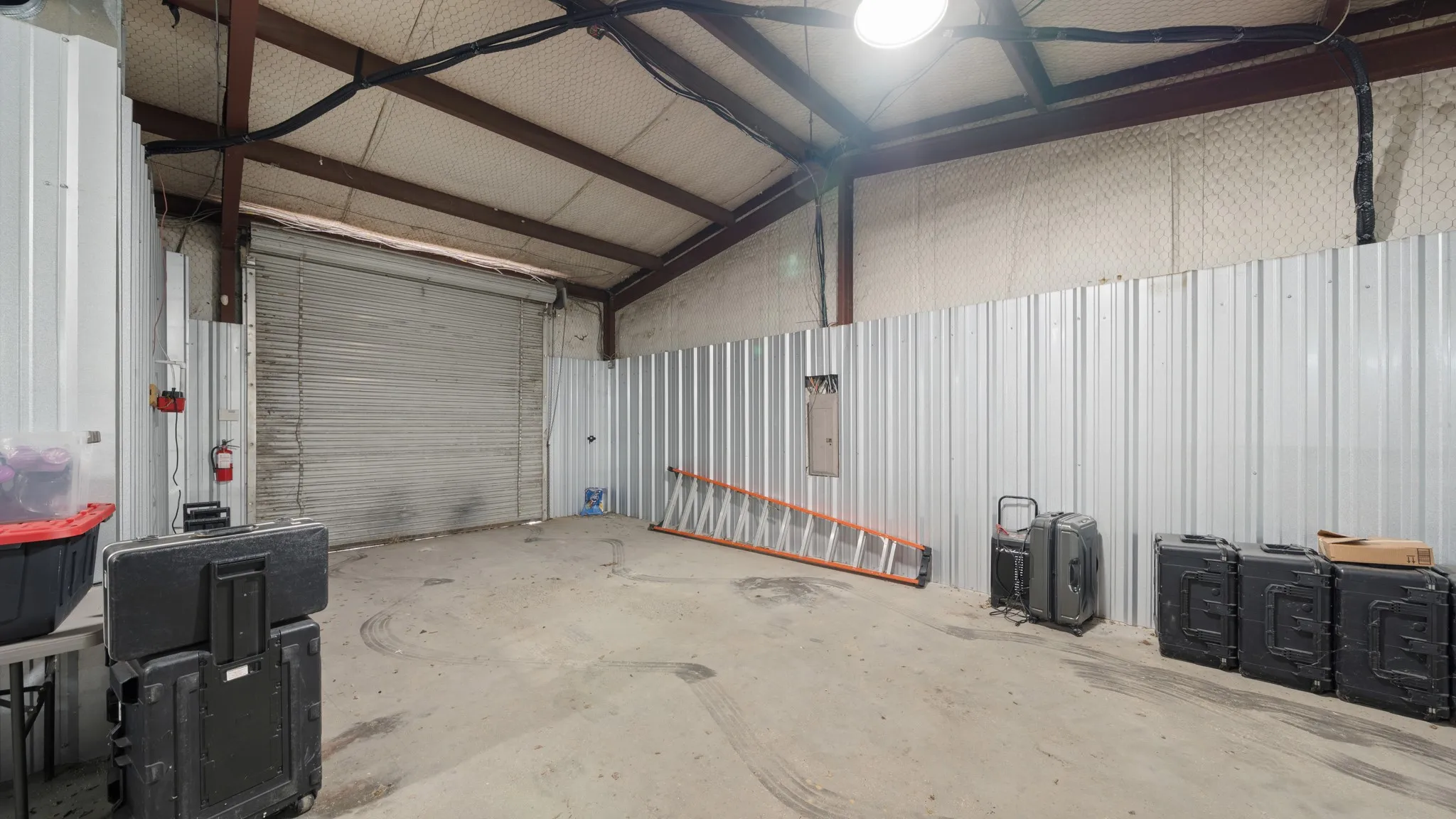 Garage with metal wall and electric panel