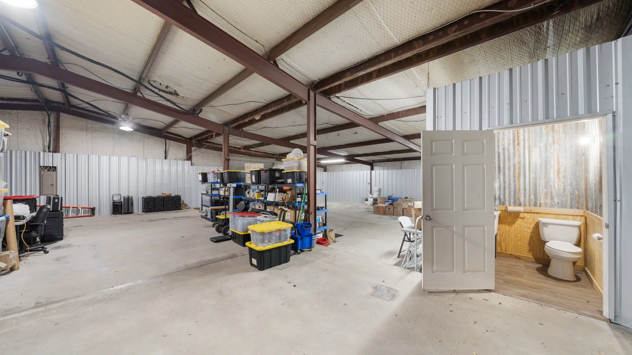 Garage featuring metal wall