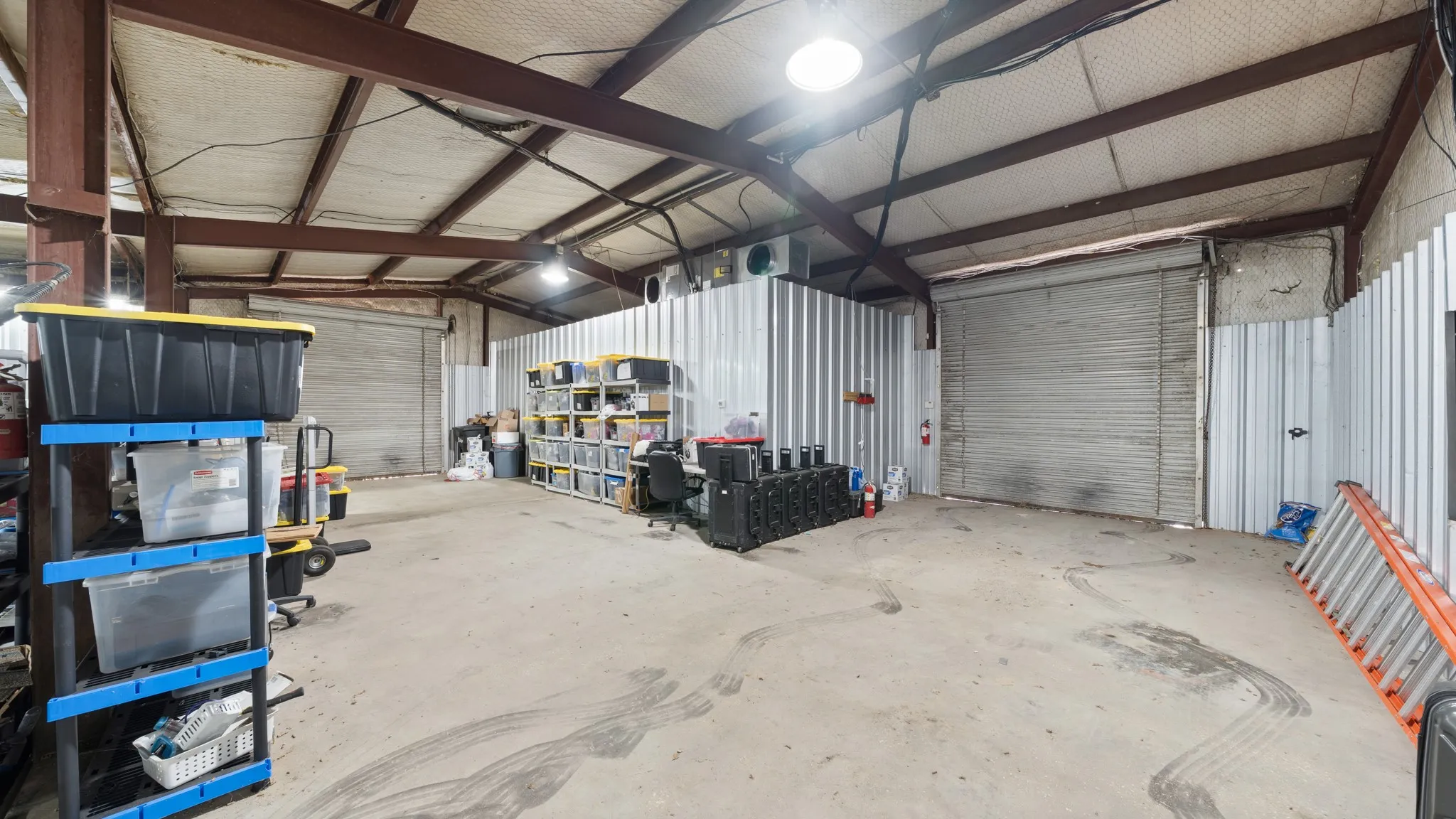 Garage featuring metal wall