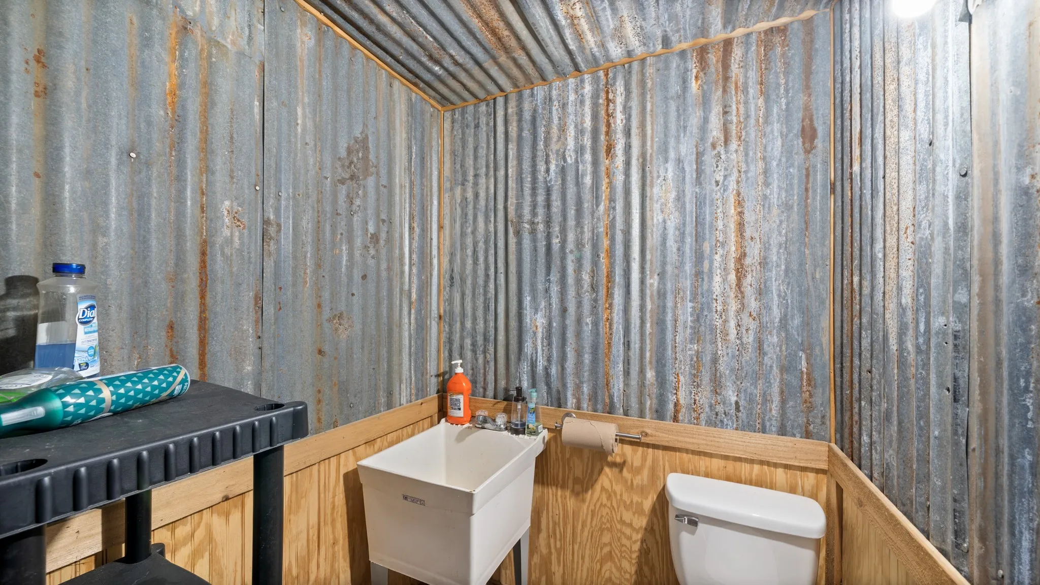 Bathroom featuring a sauna / steam room and wood walls