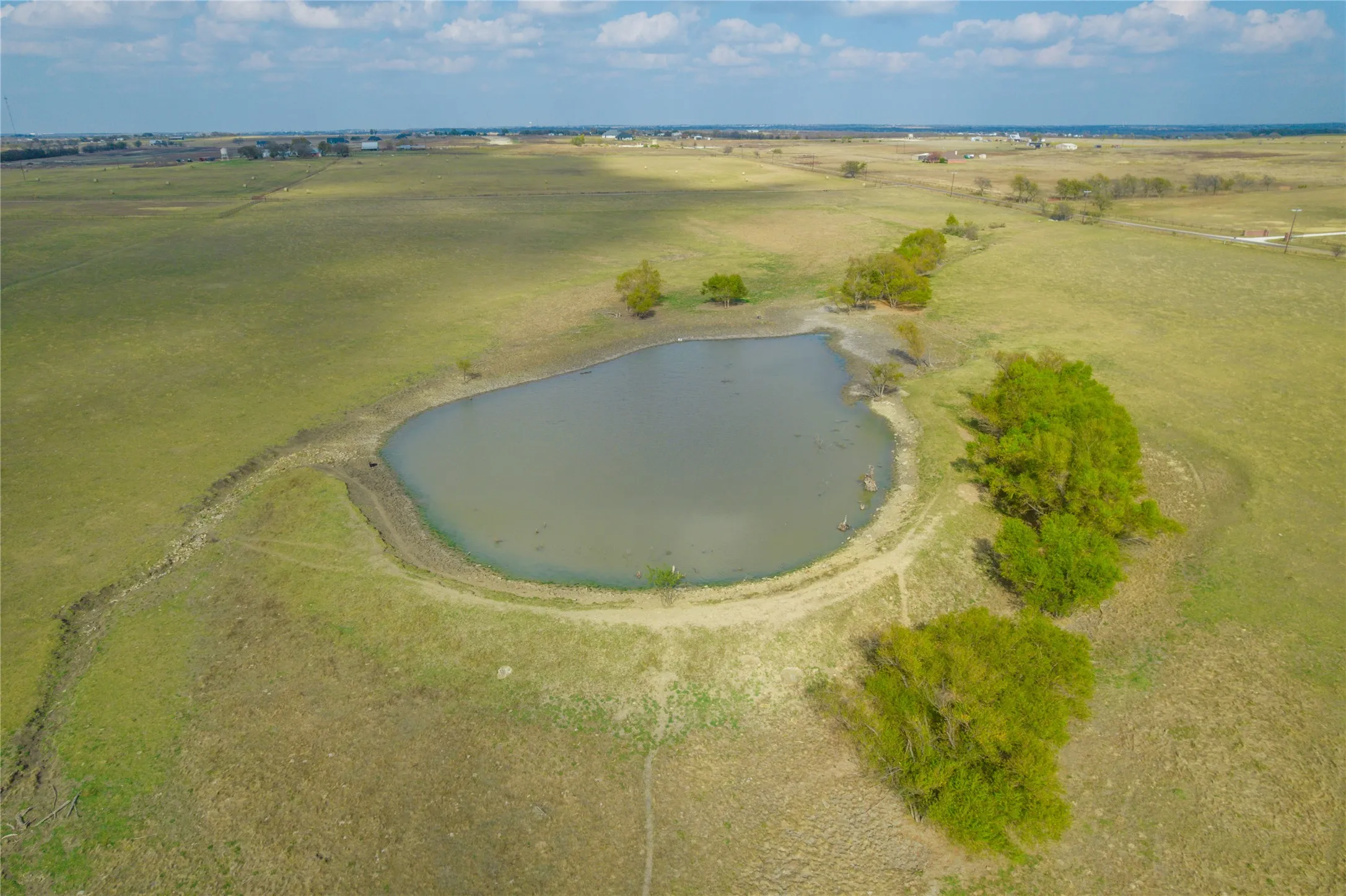 Overview of rural landscape with a nearby body of water