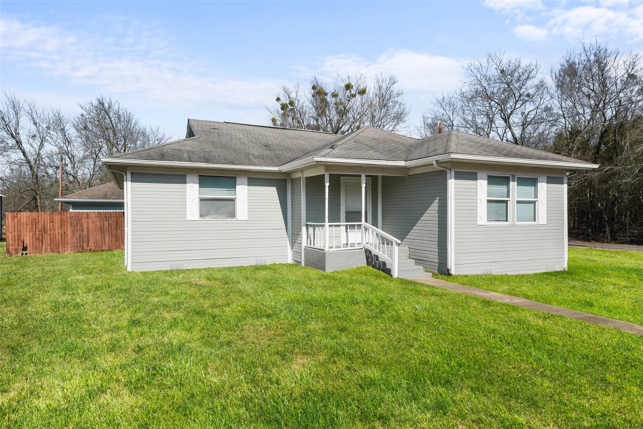 View of front of home with roof with shingles
