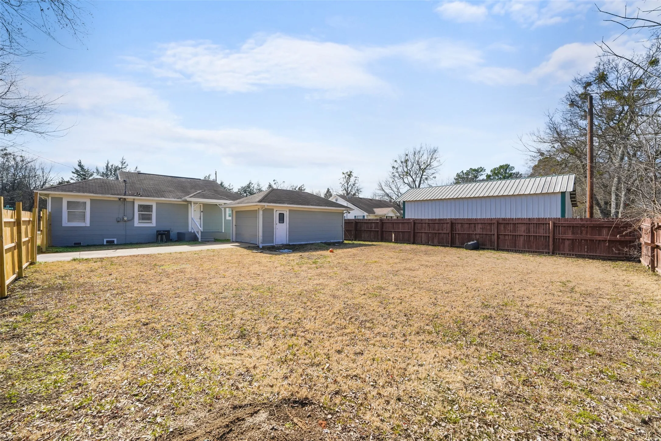 Back of house featuring a fenced backyard