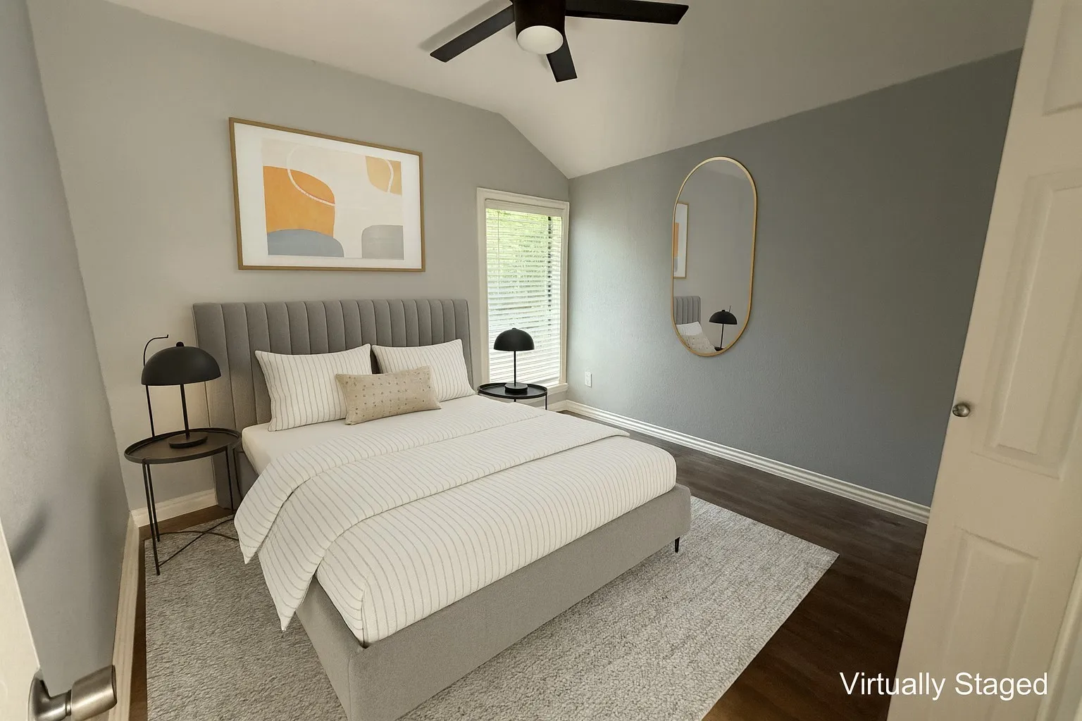 Bedroom featuring vaulted ceiling, dark wood finished floors, and a ceiling fan