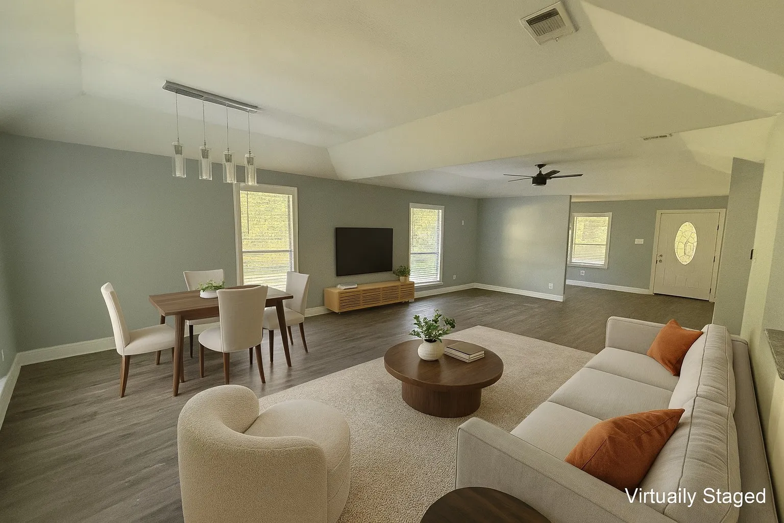 Living area with wood finished floors, lofted ceiling, and ceiling fan