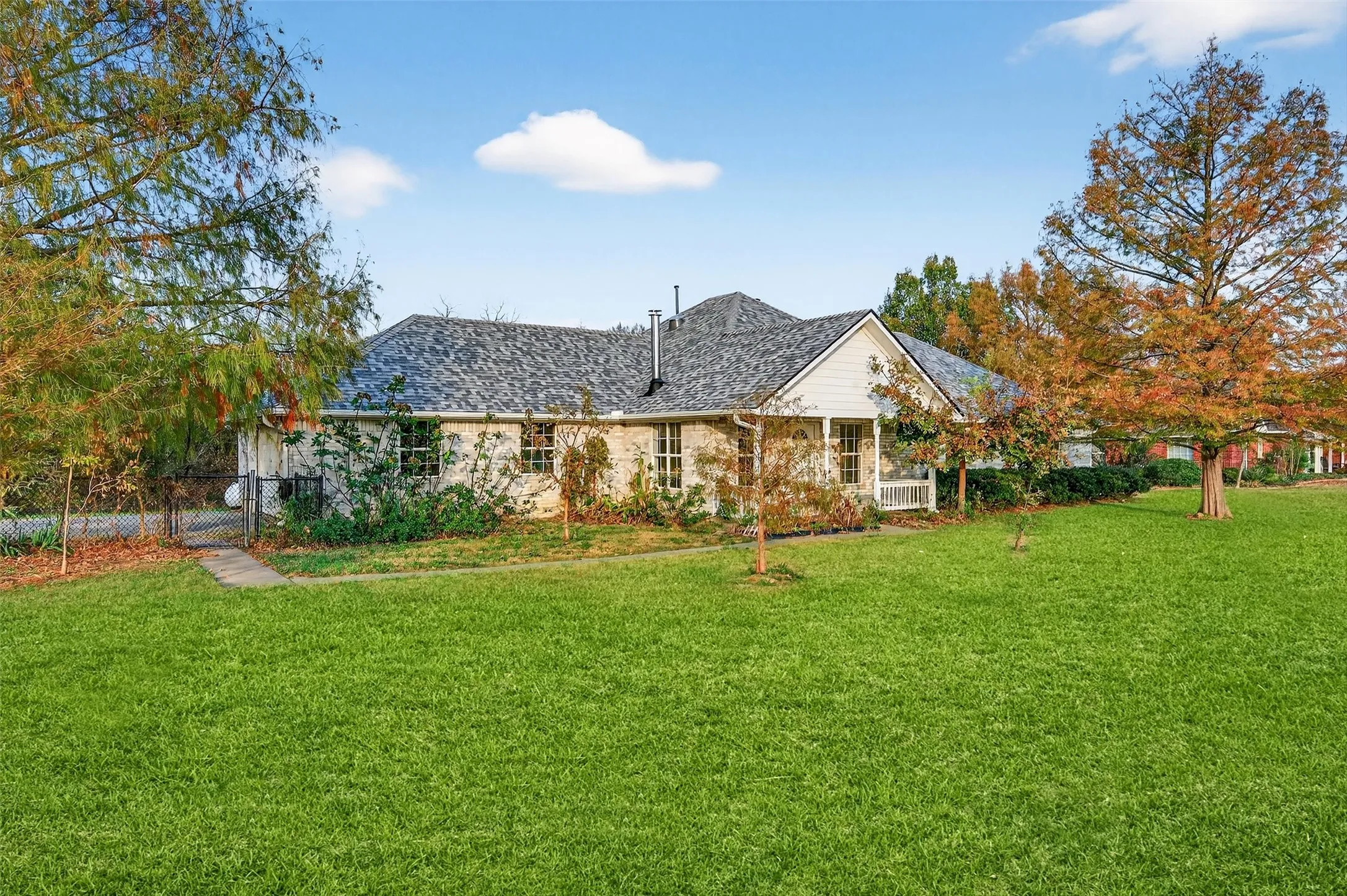 View of front of house with a gate
