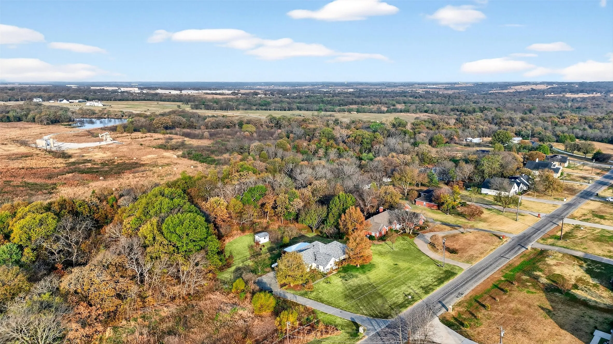 Aerial view of property's location featuring a large body of water