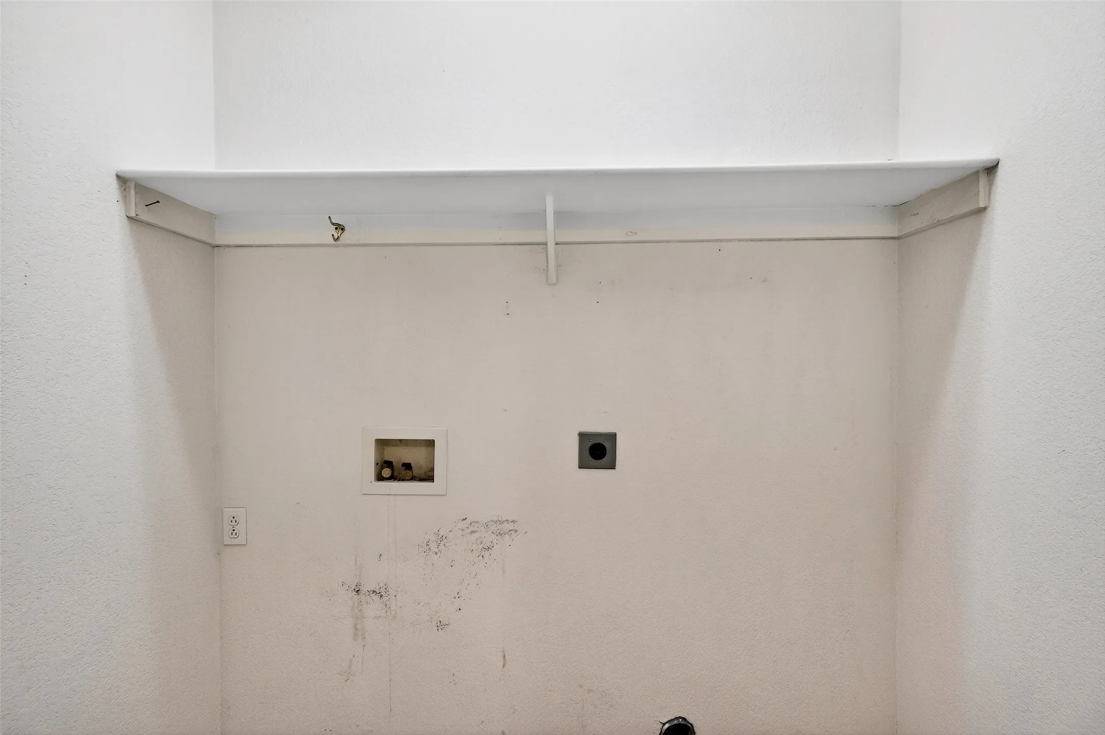 Washroom featuring hookup for a washing machine and hookup for an electric dryer
