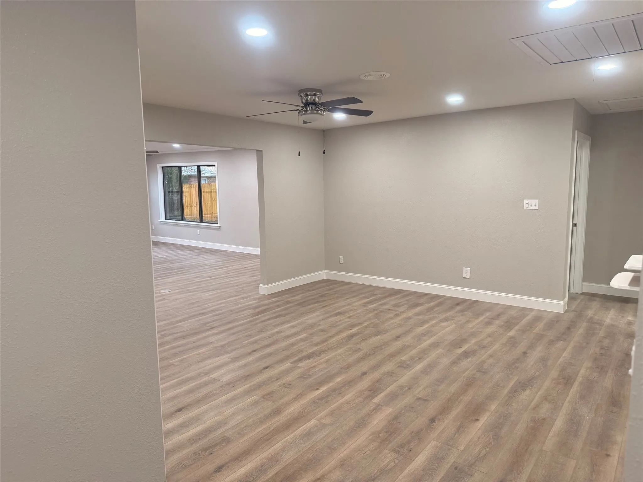 Spare room featuring light wood-style flooring, recessed lighting, and ceiling fan